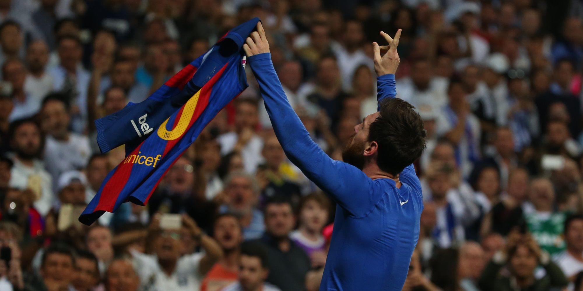 Lionel Messi celebrating in front of the Santiago-Bernabeu.