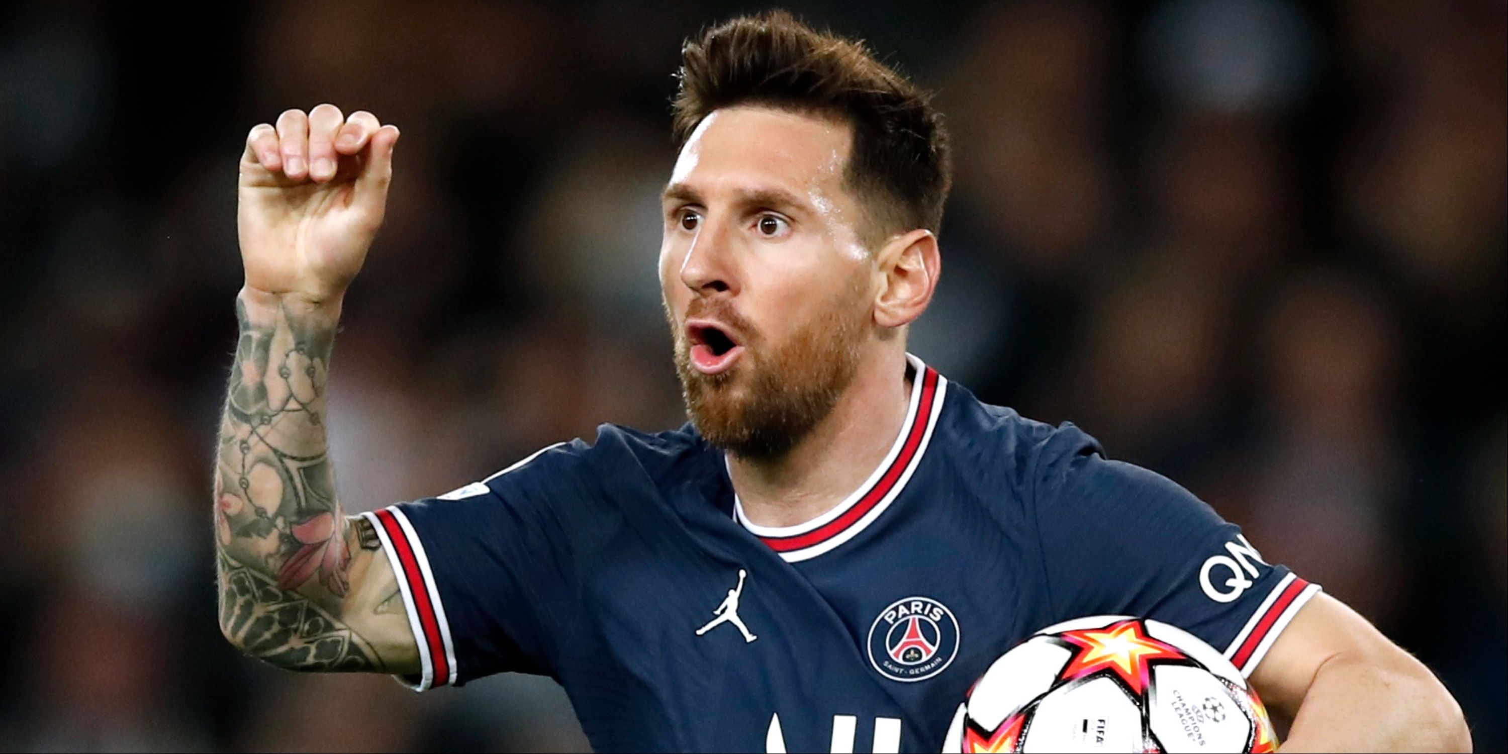 Lionel Messi celebrates scoring for PSG