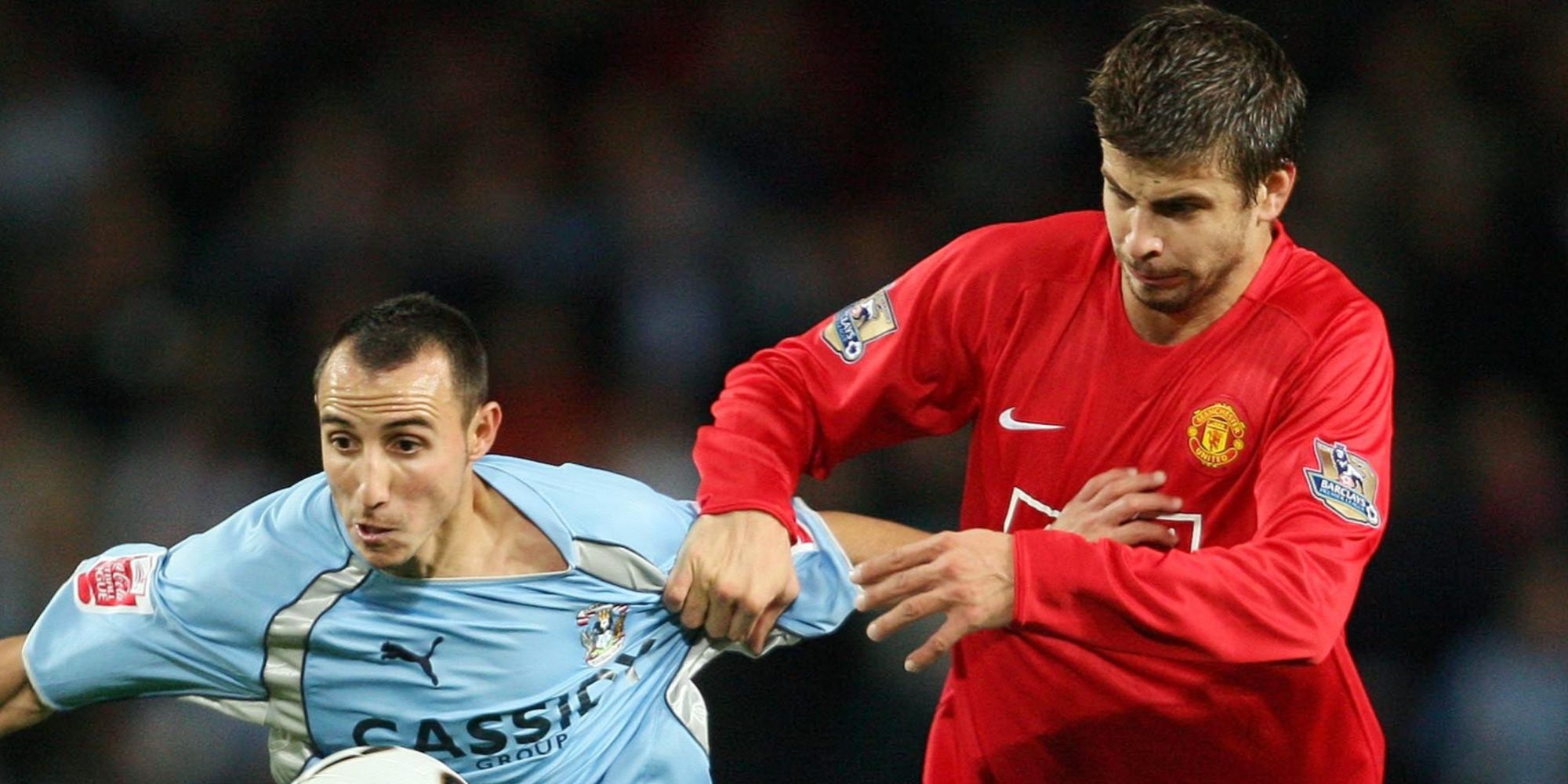 Manchester United's Gerard Pique (R) and Coventry City's Michael Mifsud