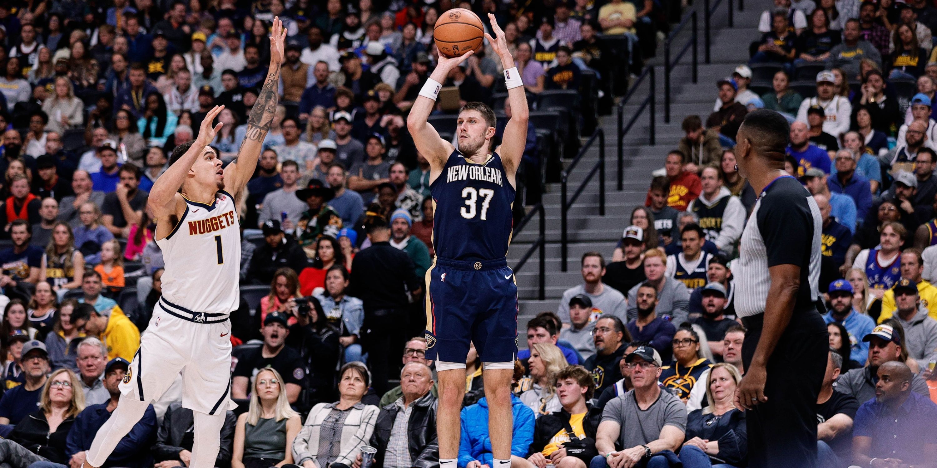 Nov 6, 2023; Denver, Colorado, USA; New Orleans Pelicans forward Matt Ryan (37) attempts a shot under pressure from Denver Nuggets forward Michael Porter Jr. (1) in the second quarter at Ball Arena. Mandatory Credit: Isaiah J. Downing-USA TODAY Sports