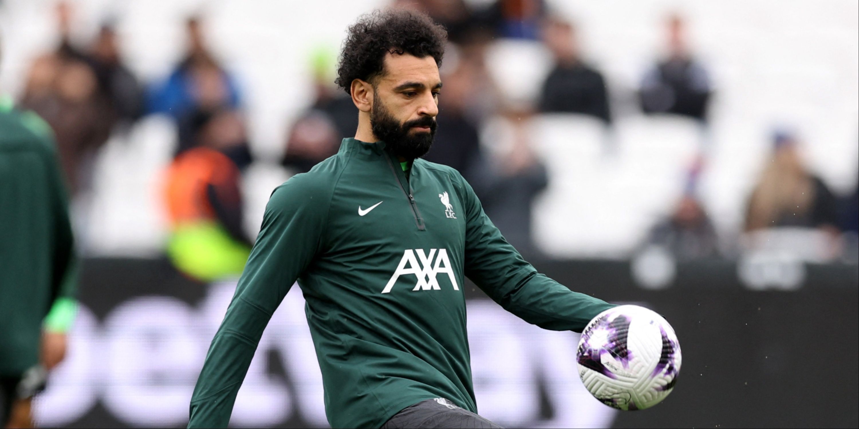 Mohamed Salah warming up for Liverpool