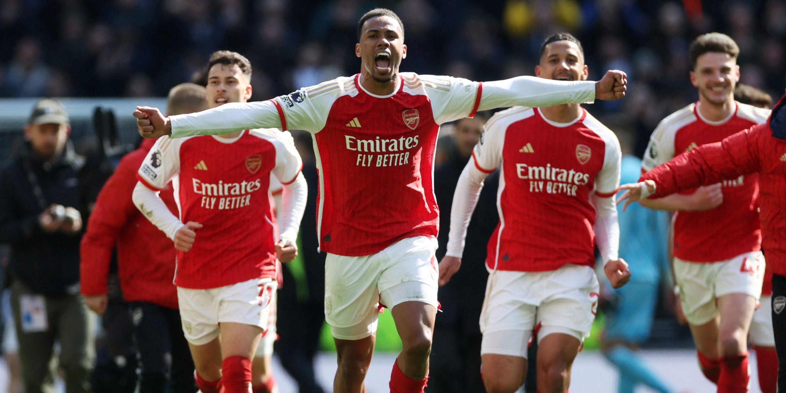 Arsenal players celebrate after beating Tottenham
