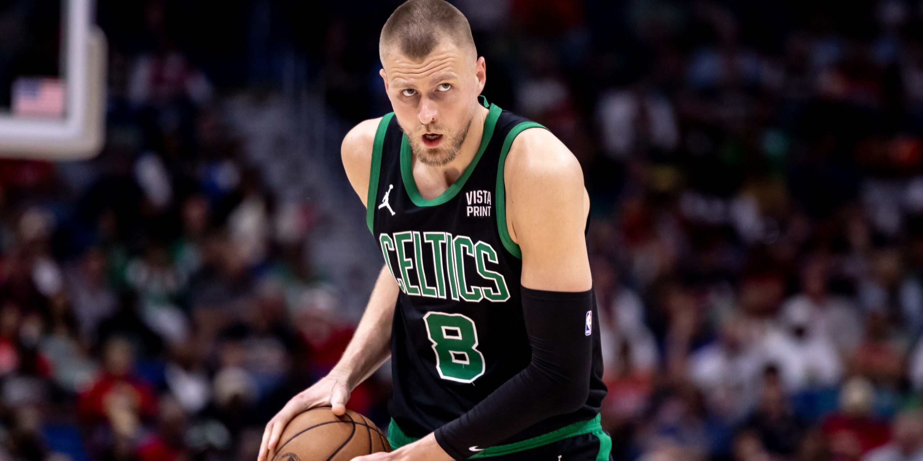 Kristaps Porzingis of the Boston Celtics surveys the defense