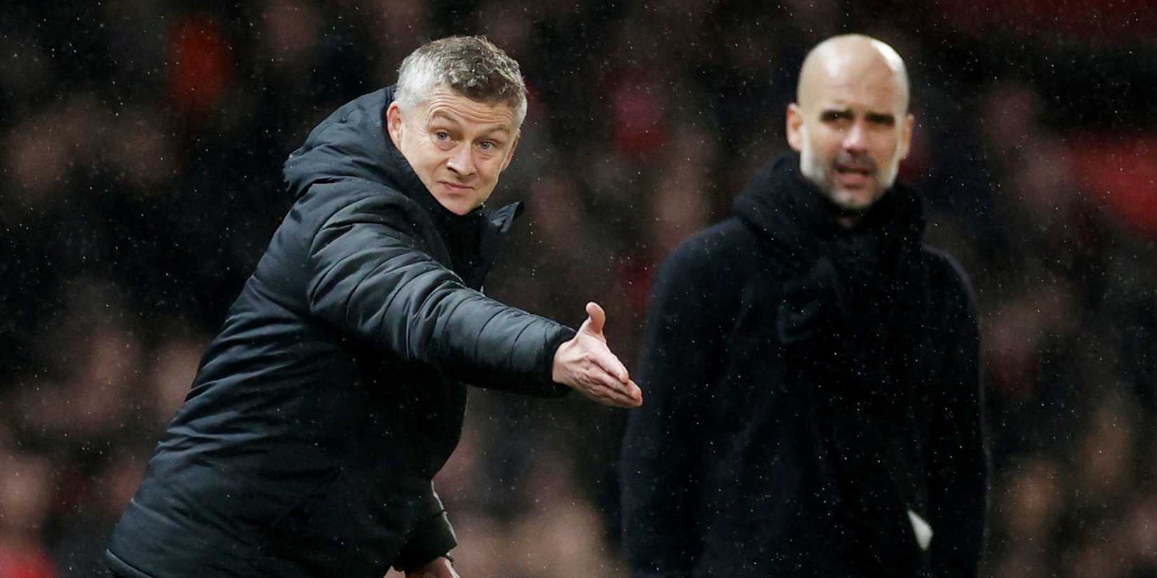 Ole Gunnar Solskjaer alongside Pep Guardiola in the Manchester derby