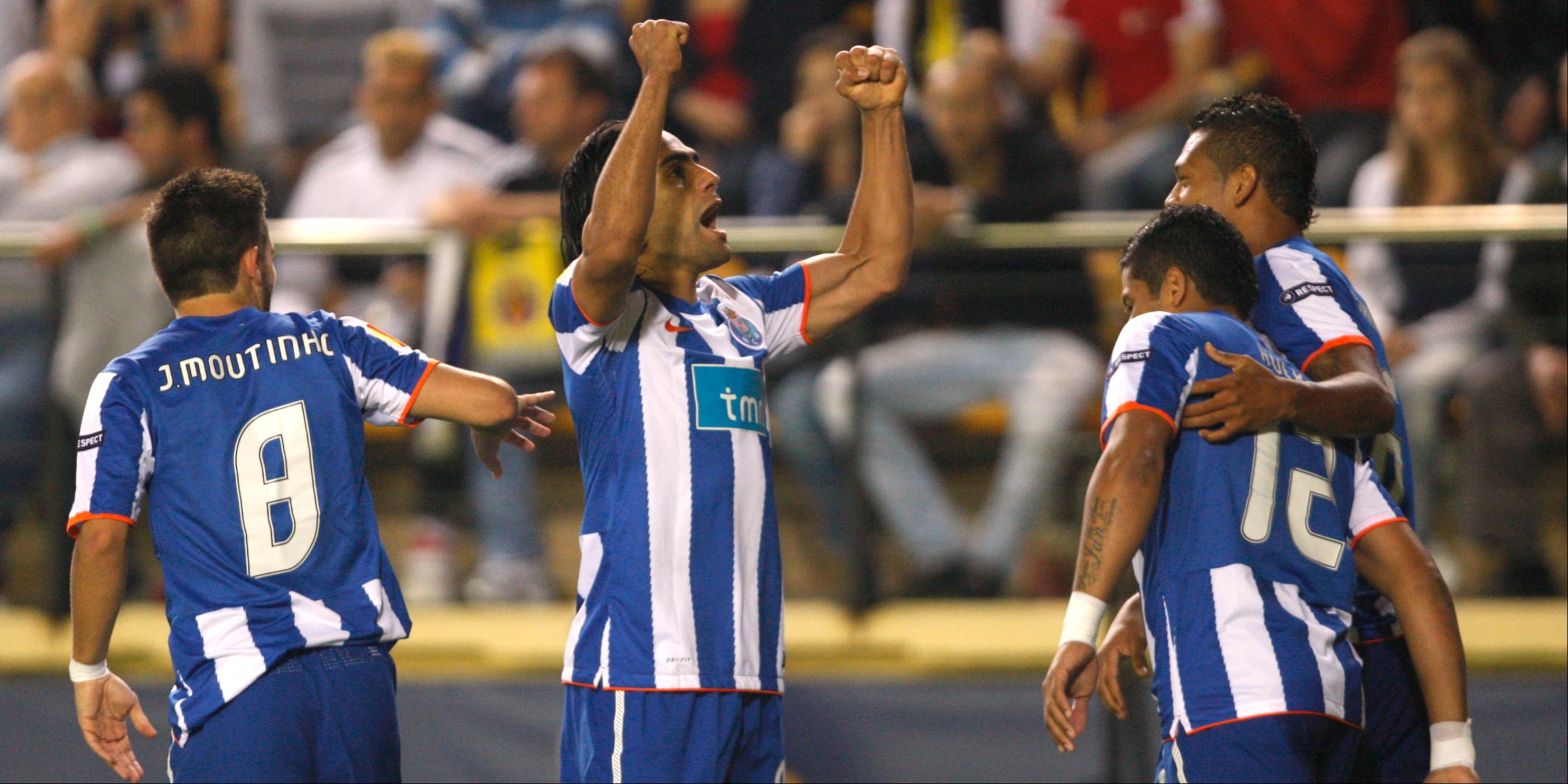 Porto's Radamel Falcao celebrates scoring along with Hulk and Joao Moutinho.