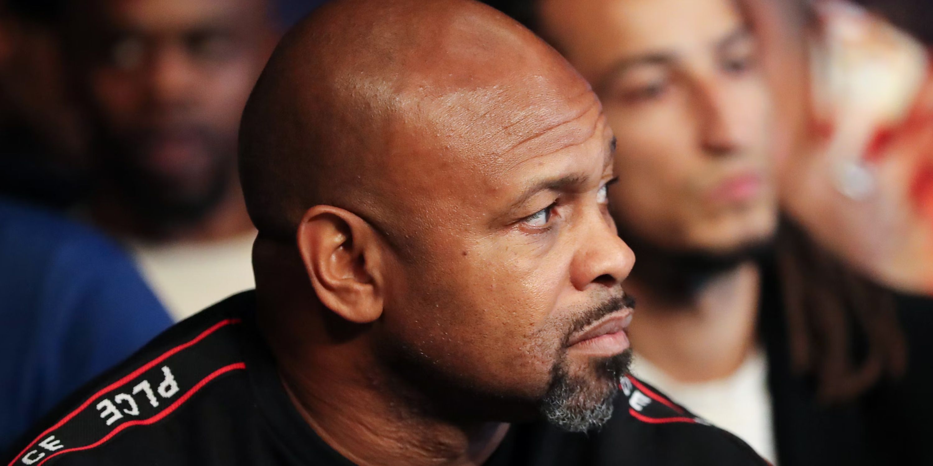 Roy Jones Junior watches a fight from ringside