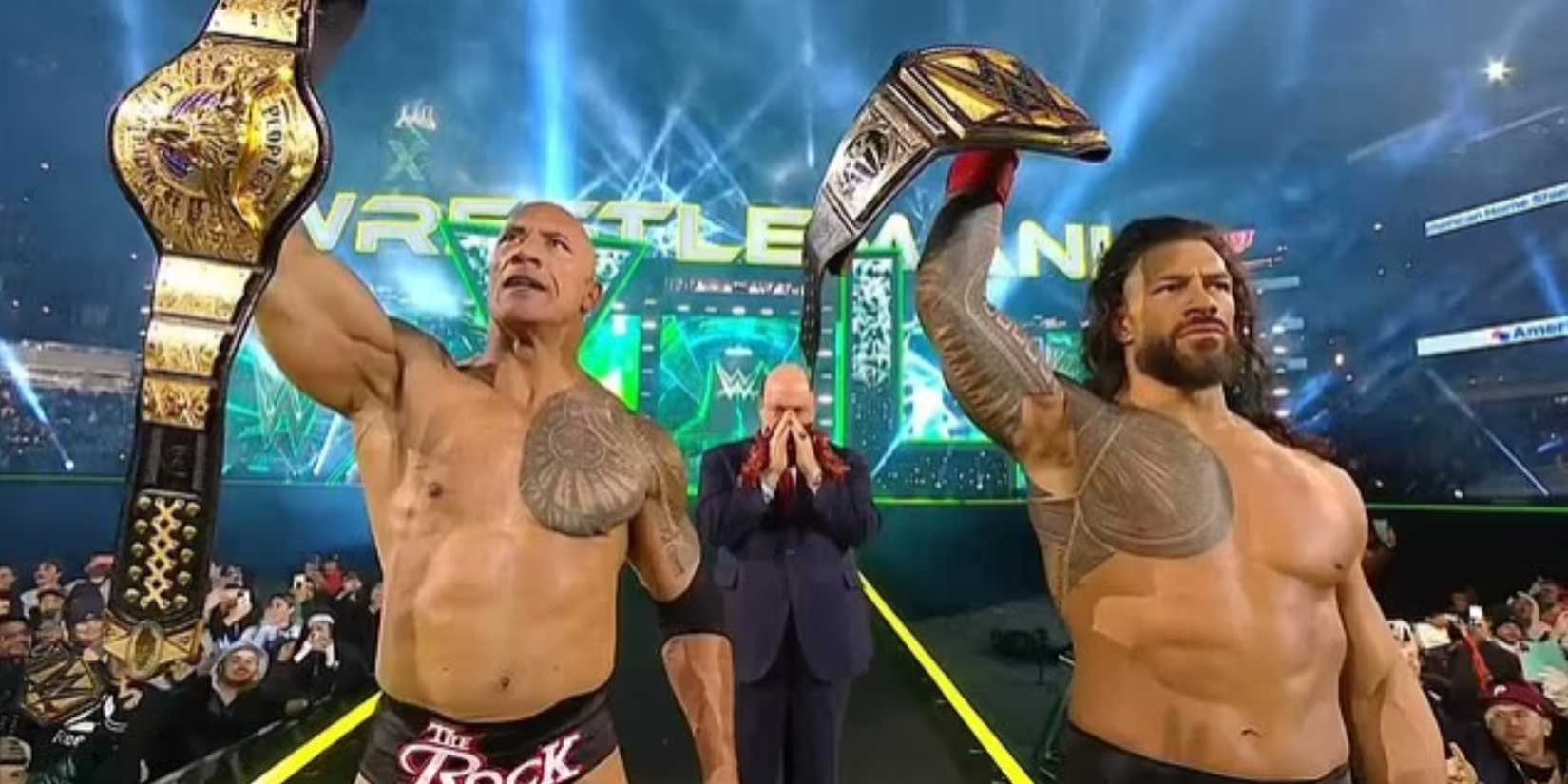 The Rock and Roman Reigns celebrate at WrestleMania 40