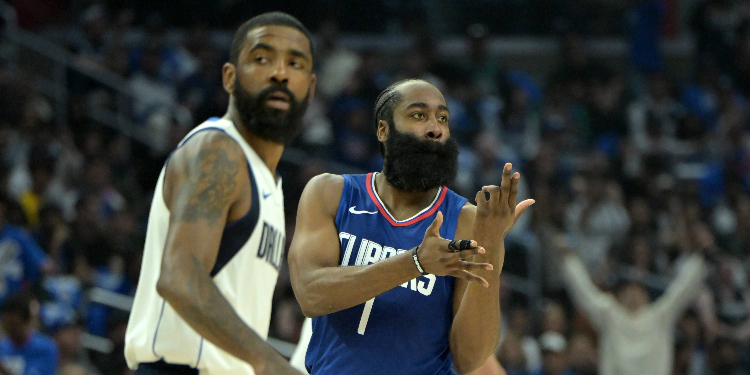 James Harden reacts after a play against the Mavericks.