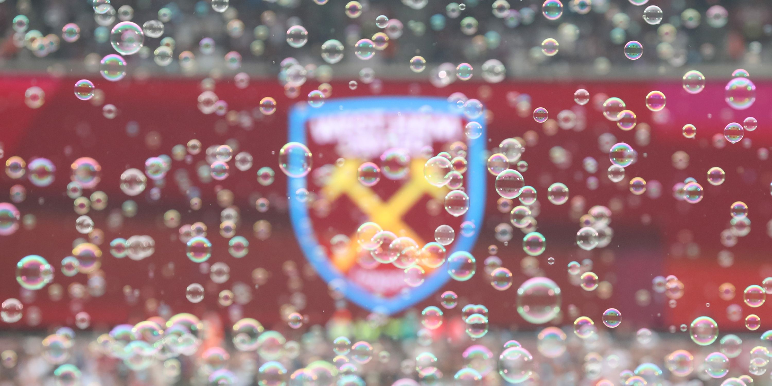 Bubbles fluttering in front of the West Ham badge