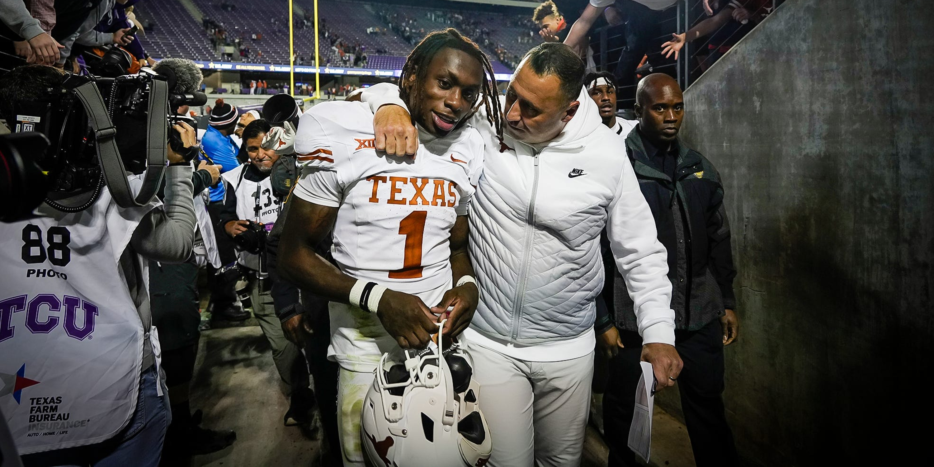 Texas WR Xavier Worthy with head coach Steve Sarkisian in postgame tunnel following victory over TCU
