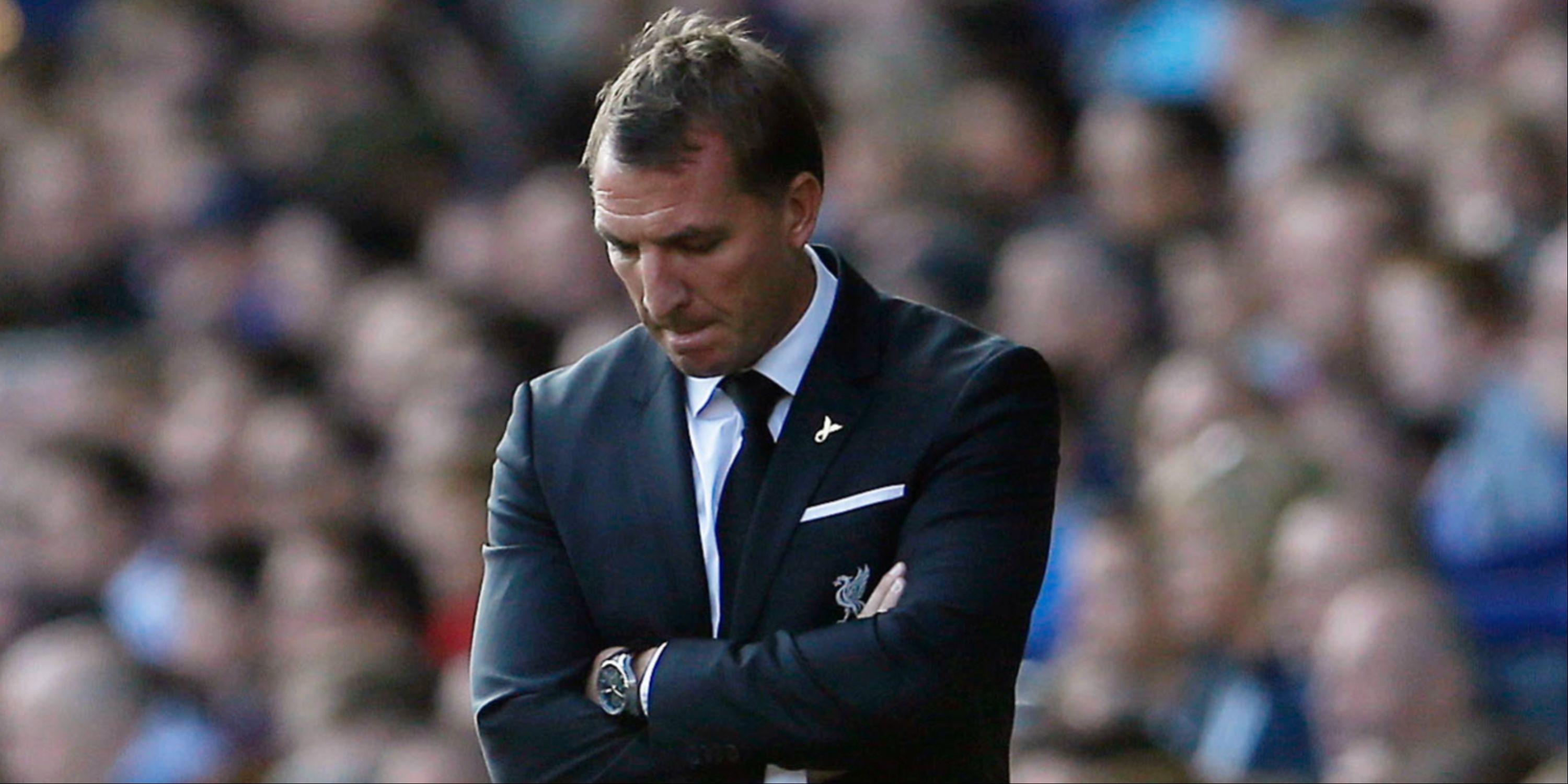 Liverpool manager Brendan Rodgers looks dejected on the touchline.