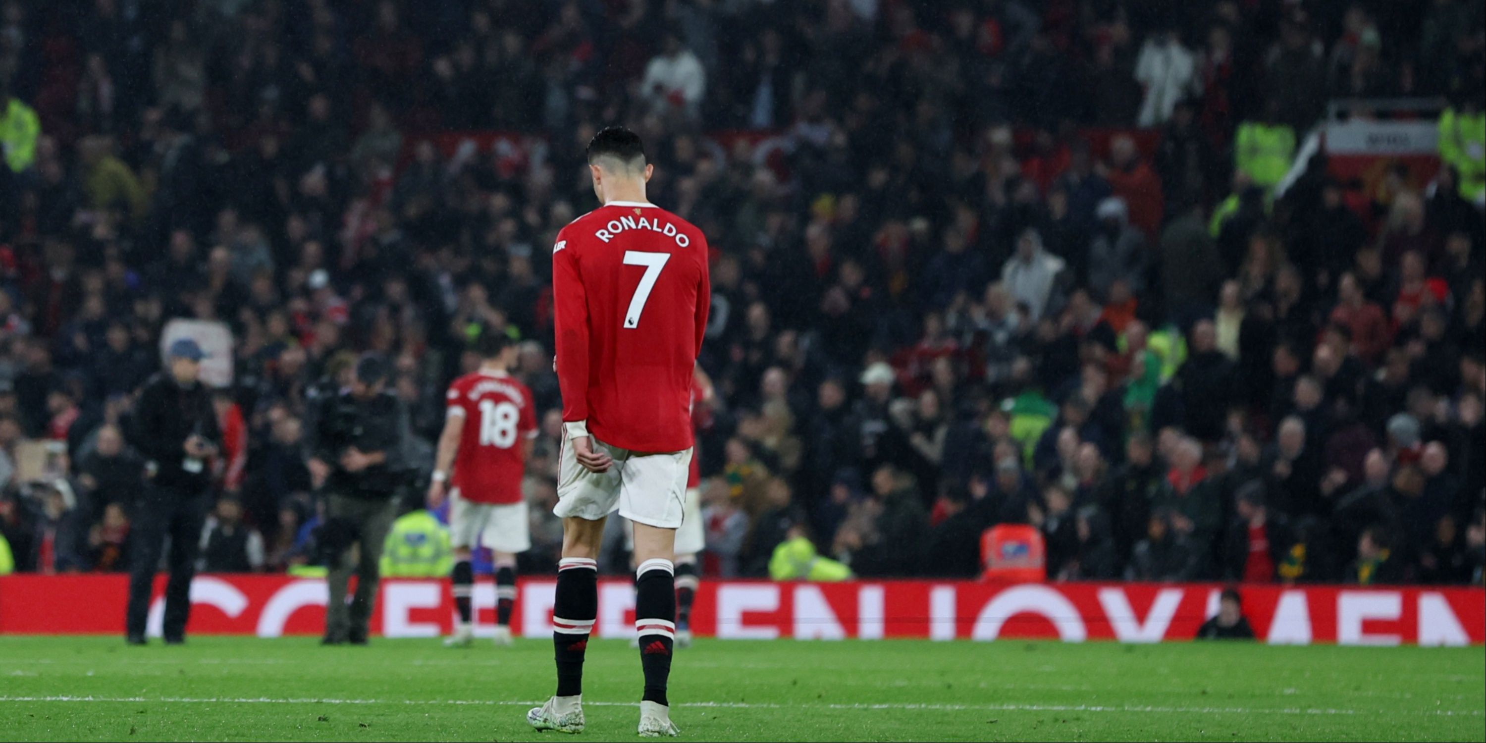 Manchester United's Cristiano Ronaldo walks off the pitch with his back to the camera, displaying the iconic no.7 on his back.