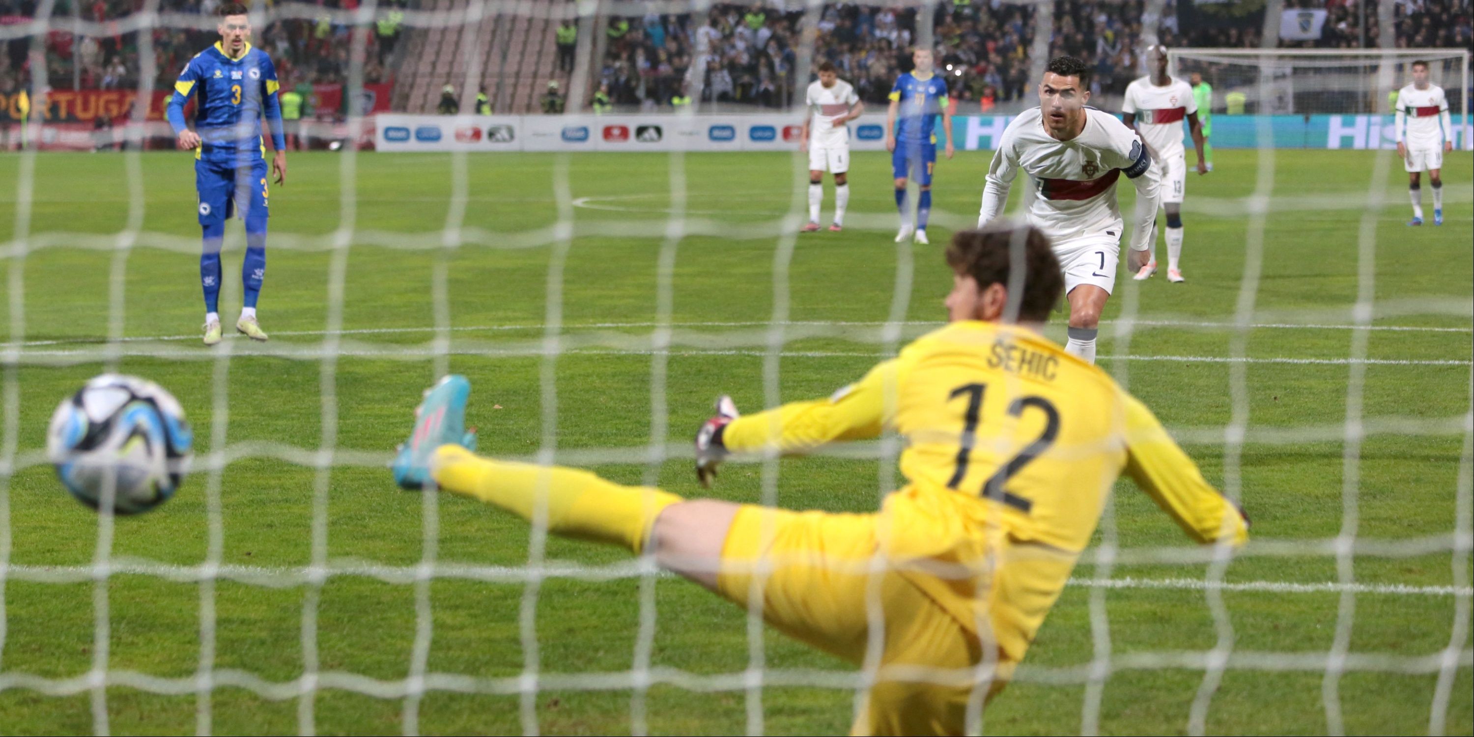 Cristiano Ronaldo scores a penalty for Portugal.