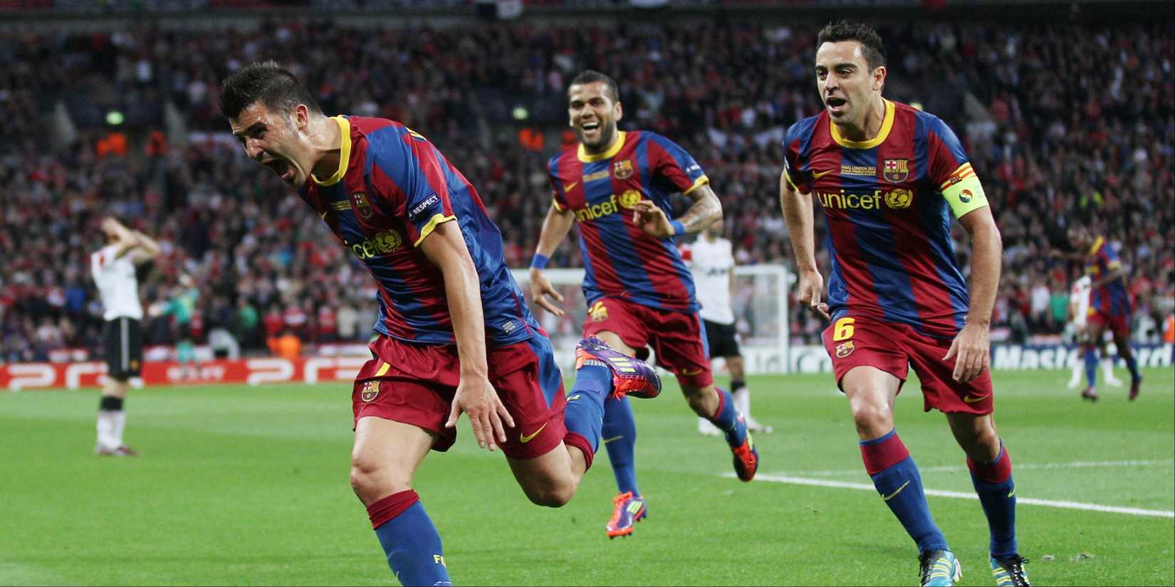 Barcelona's David Villa celebrates scoring against Manchester United with teammates Xavi and Dani Alves.