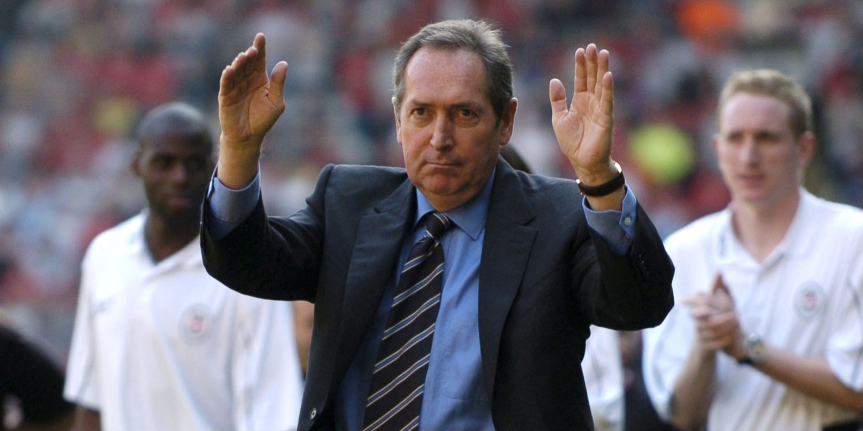 Gerard Houllier gestures to the Liverpool supporters. 