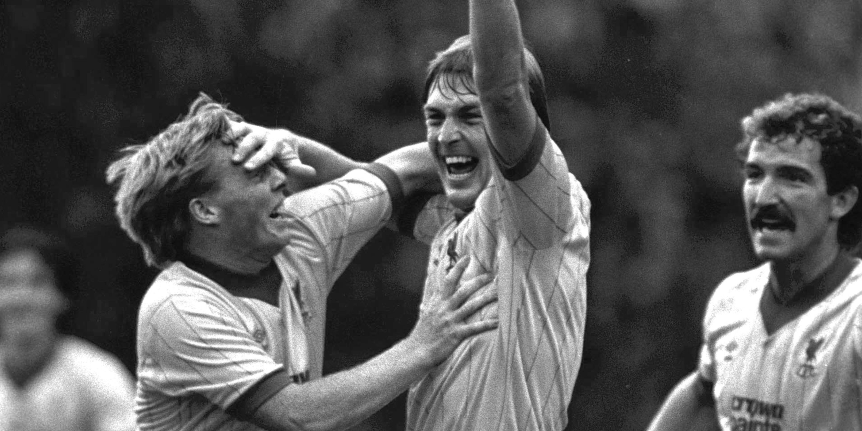 Liverpool players Kenny Dalglish, Sammy Lee and Graeme Souness celebrate a goal together.