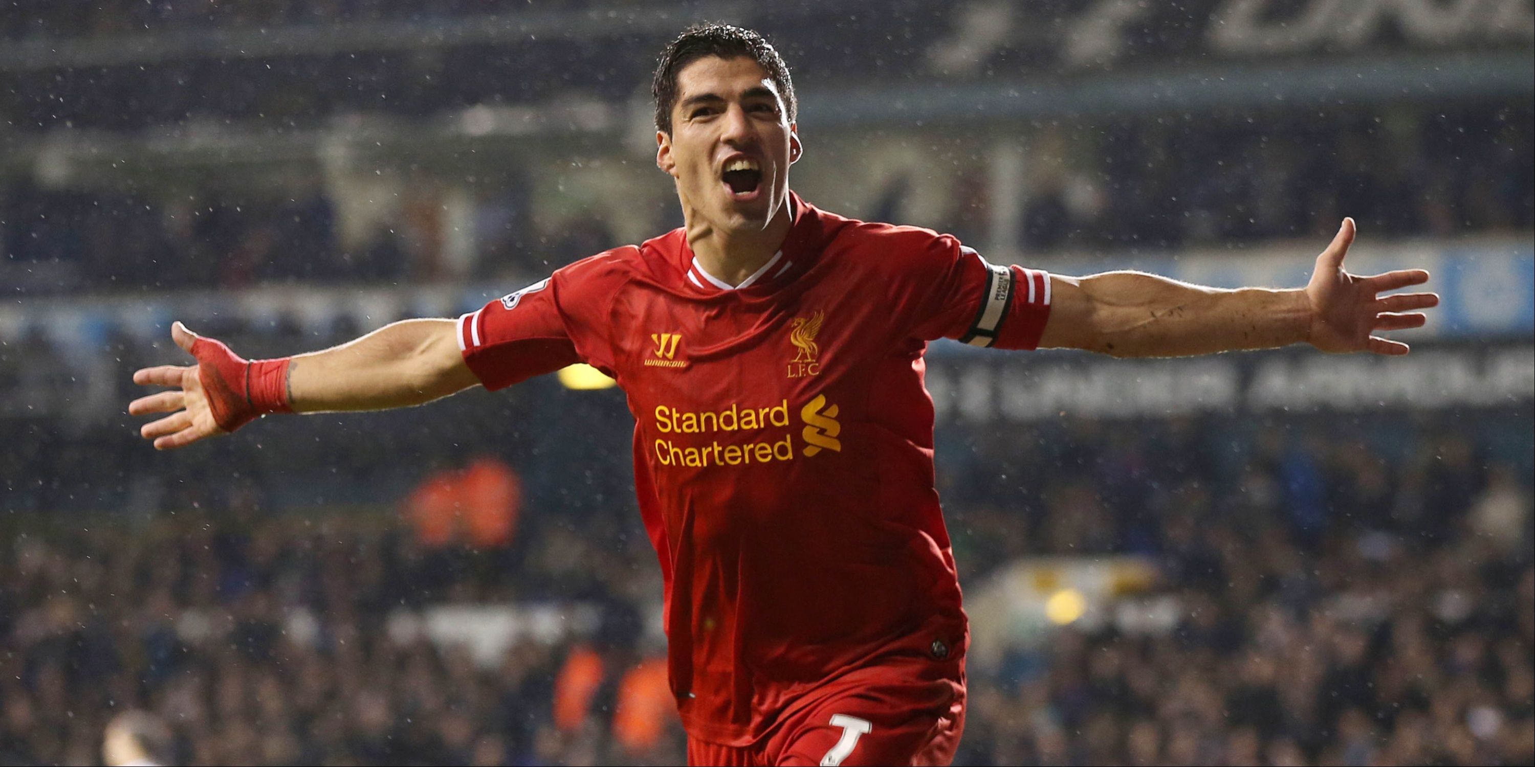 Luis Suarez celebrates scoring for Liverpool.