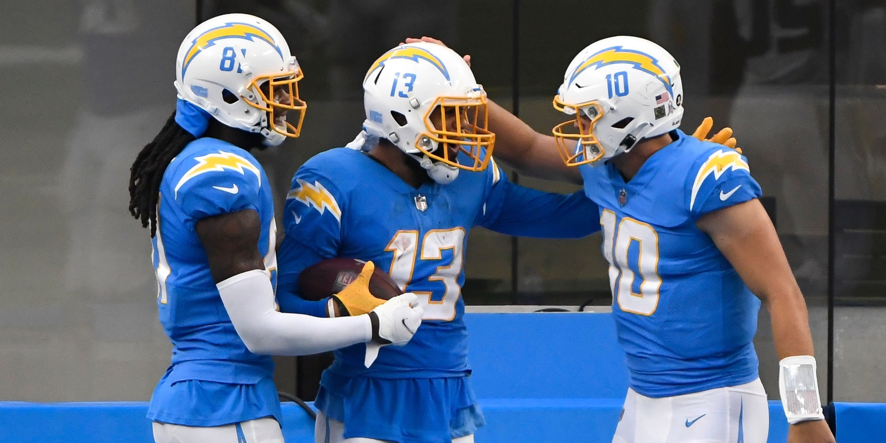 Justin Herbert, Keenan Allen and Mike Williams celebrate a touchdown 