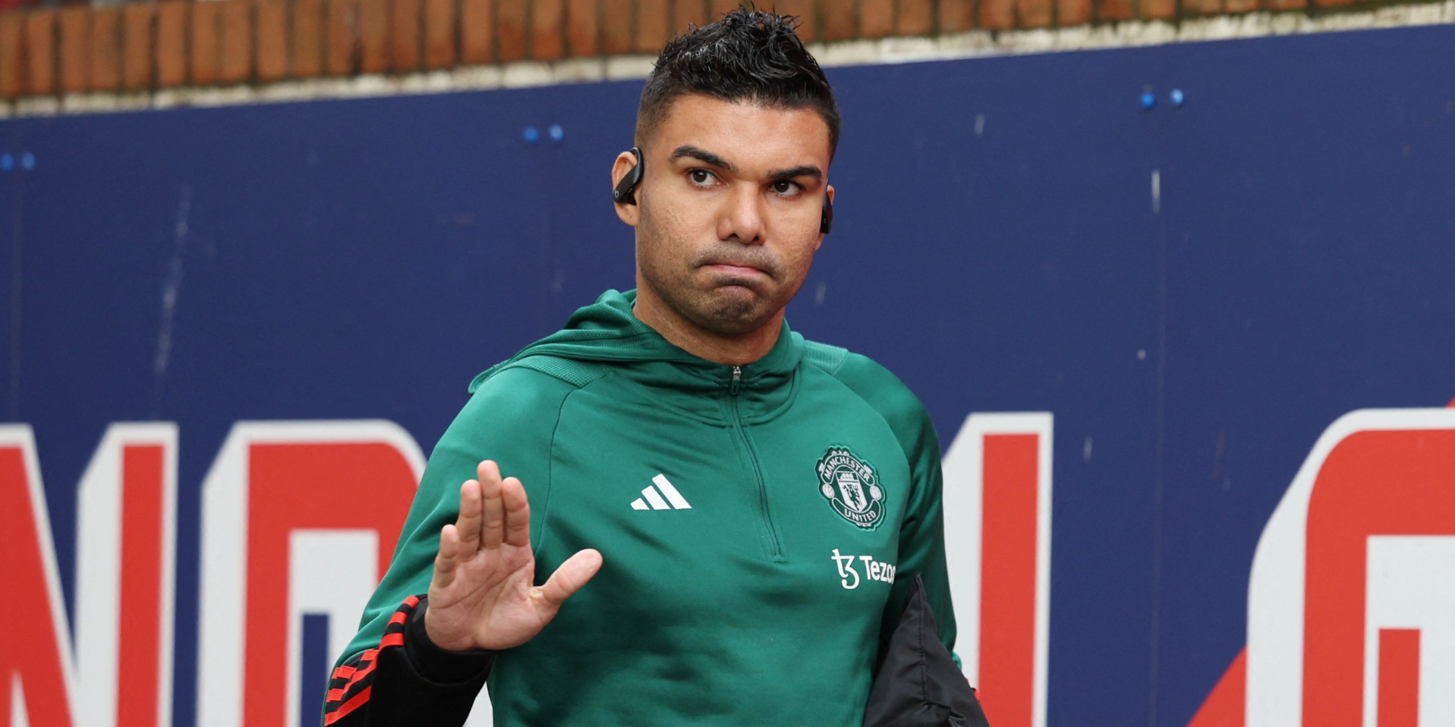 Manchester United defensive midfielder Casemiro waving to supporters