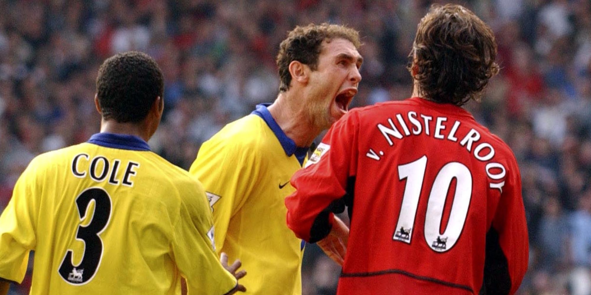 Martin Keown , Ray Parlour, Kolo Toure and Lauren of Arsenal taunt Ruud Van Nistelrooy of Manchester United