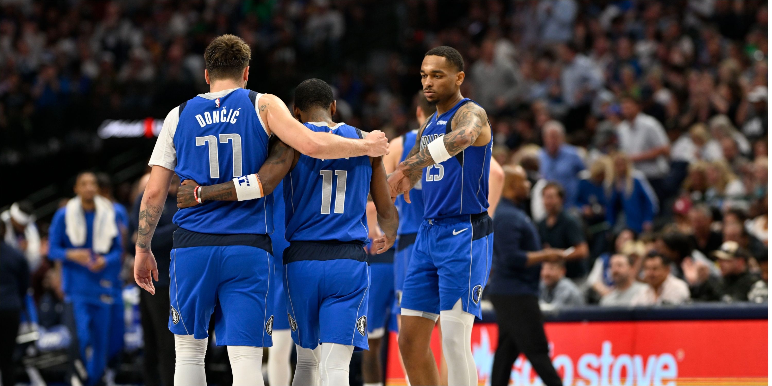 Dallas Mavericks players Luka Dončić, Kyrie Irving and P.J. Washington during a game against the at the American Airlines Center.