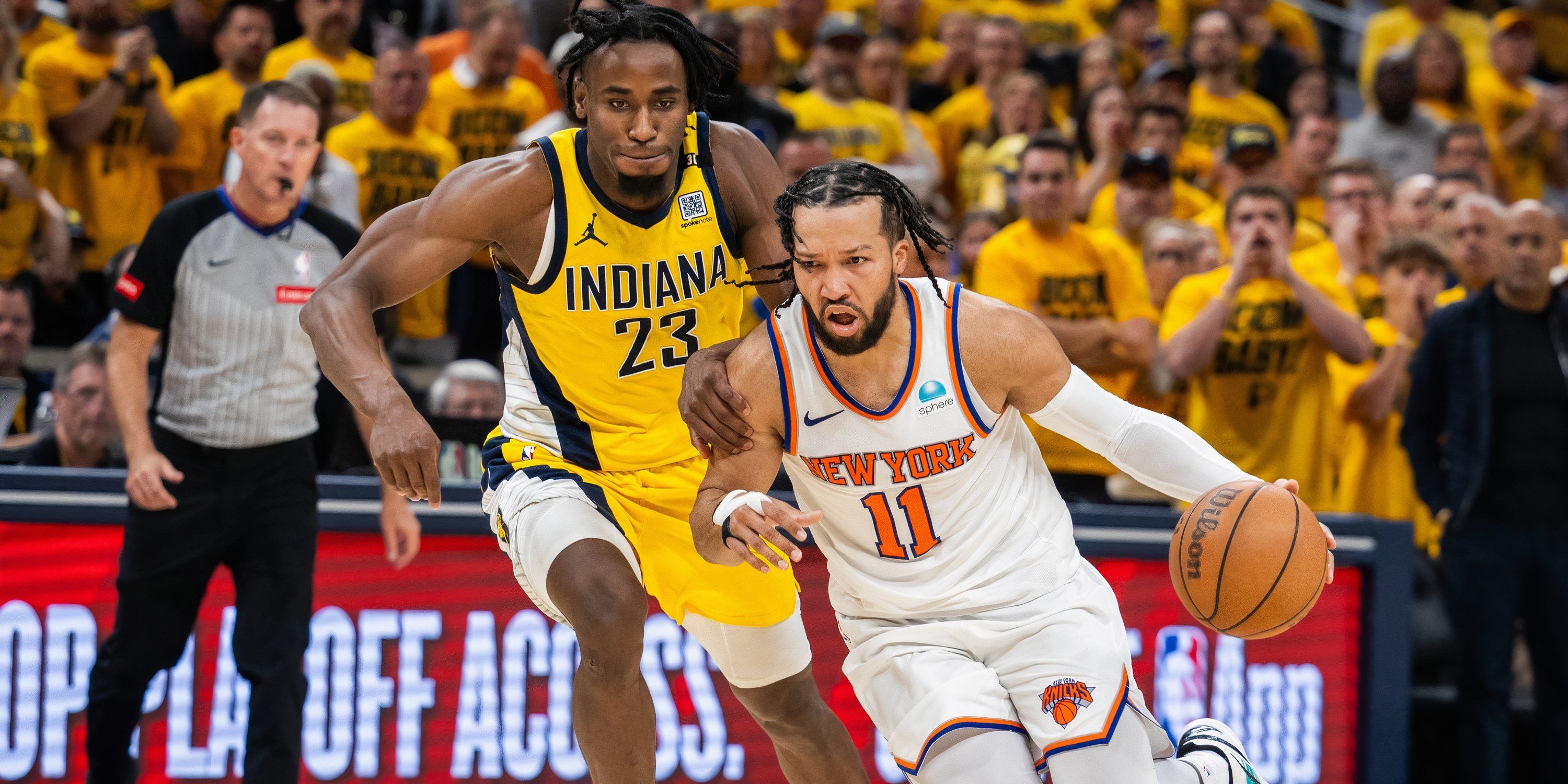 May 10, 2024; Indianapolis, Indiana, USA; New York Knicks guard Jalen Brunson (11) dribbles the ball while Indiana Pacers forward Aaron Nesmith (23) defends during game three of the second round for the 2024 NBA playoffs at Gainbridge Fieldhouse. Mandatory Credit: Trevor Ruszkowski-USA TODAY Sports