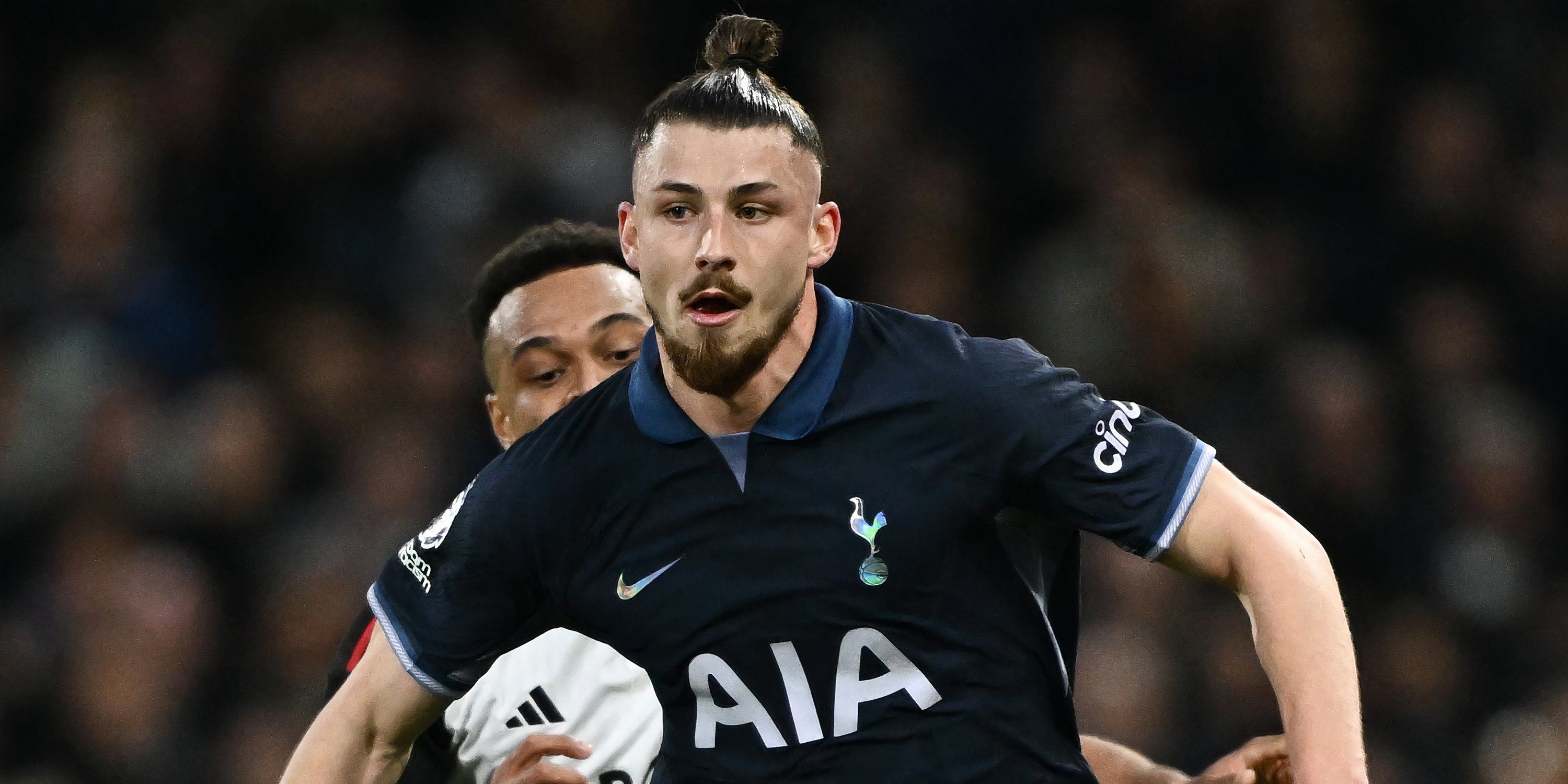 Tottenham Hotspur defender Radu Dragusin in action