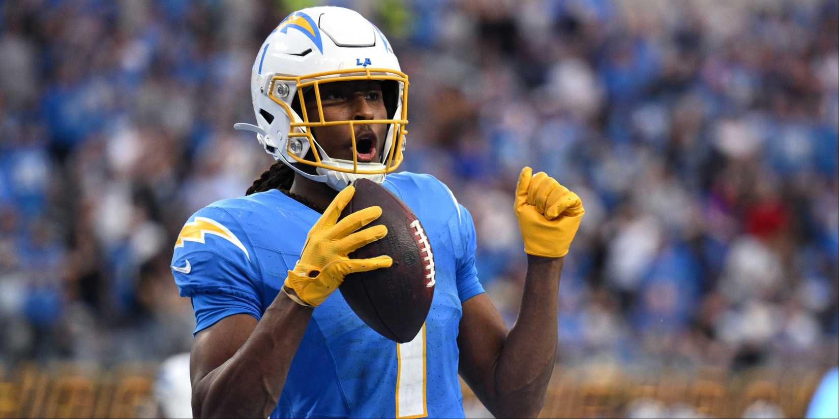 Los Angeles Chargers WR Quentin Johnston celebrates with the ball