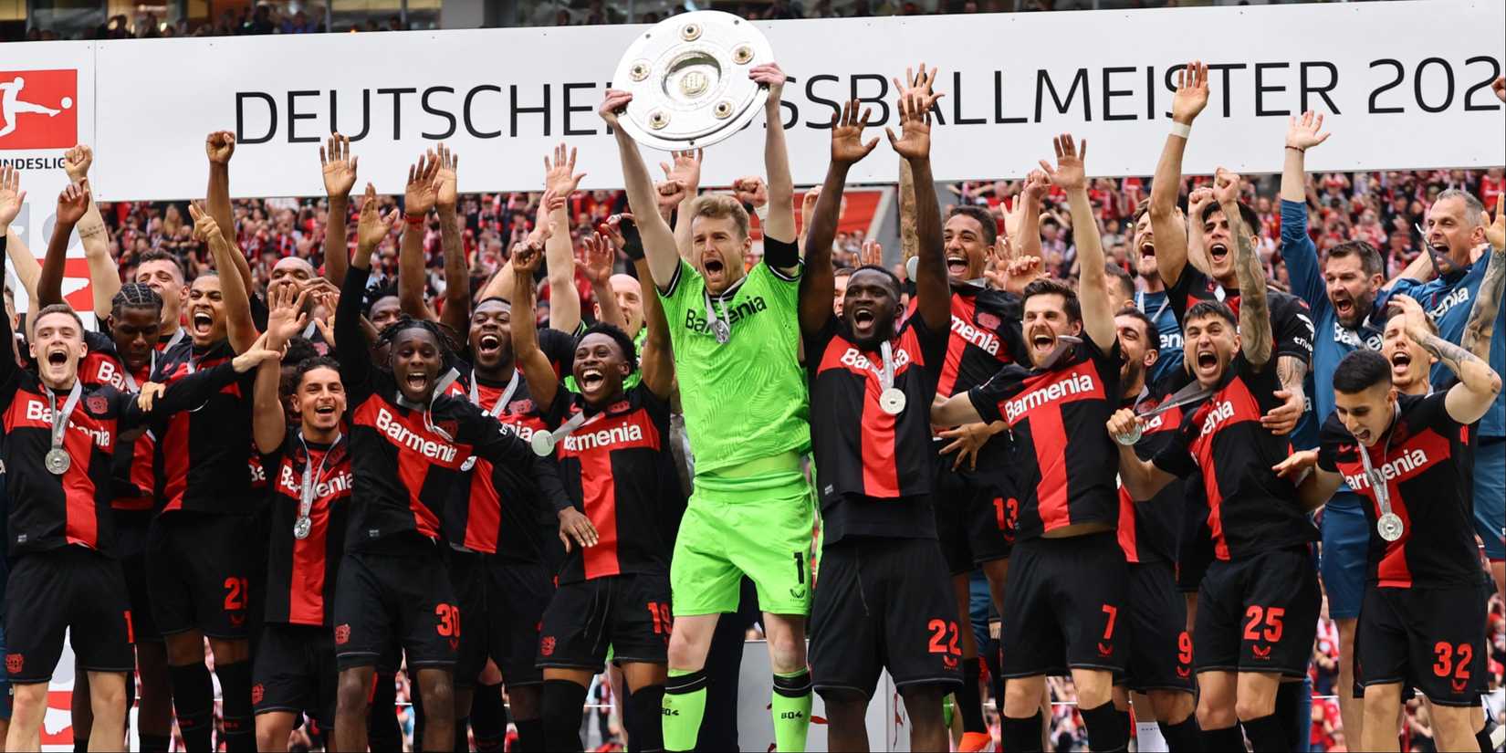 Bayer Leverkusen players celebrate winning the Bundesliga