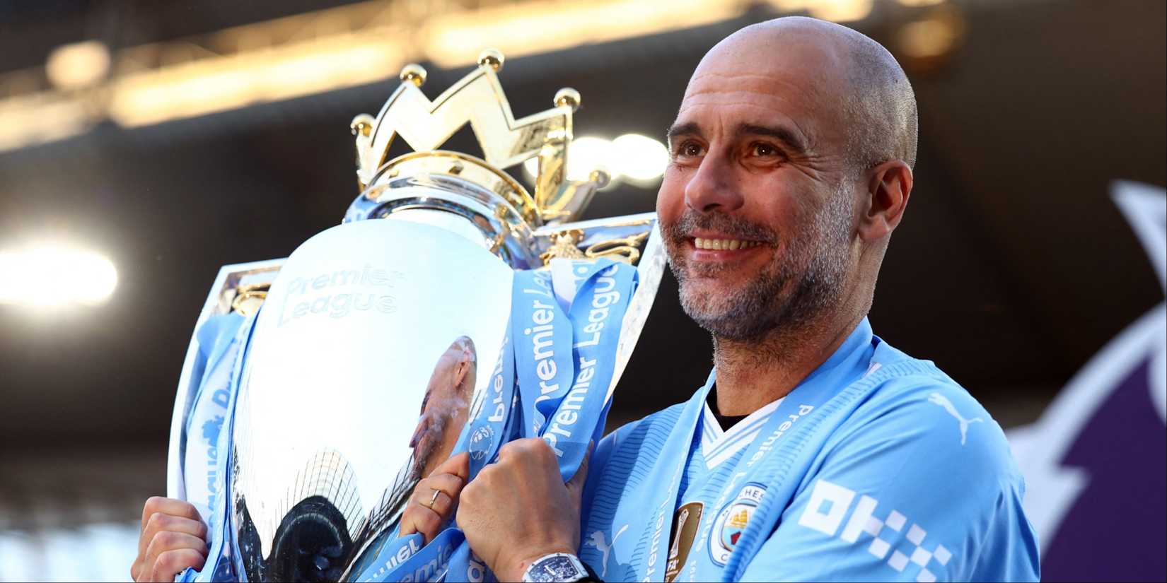 Manchester City manager Pep Guardiola with the Premier League trophy