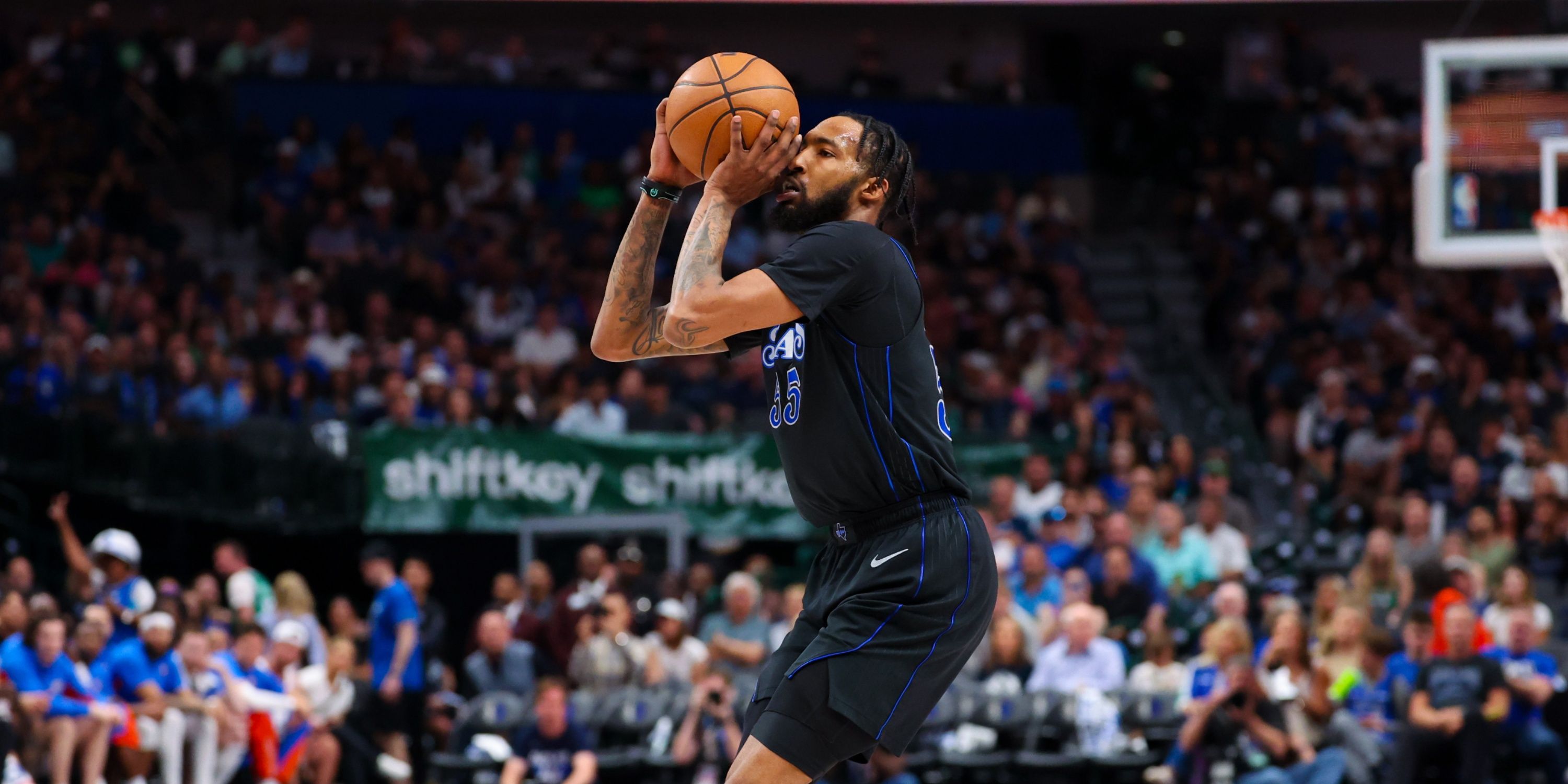 Mavs forward Derrick Jones Jr. shooting a three-pointer