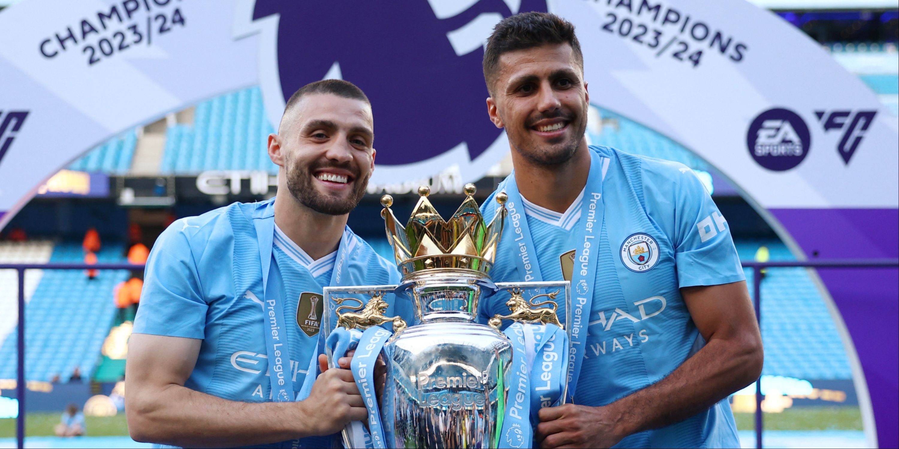 Mateo Kovacic and Rodri with the Premier League trophy