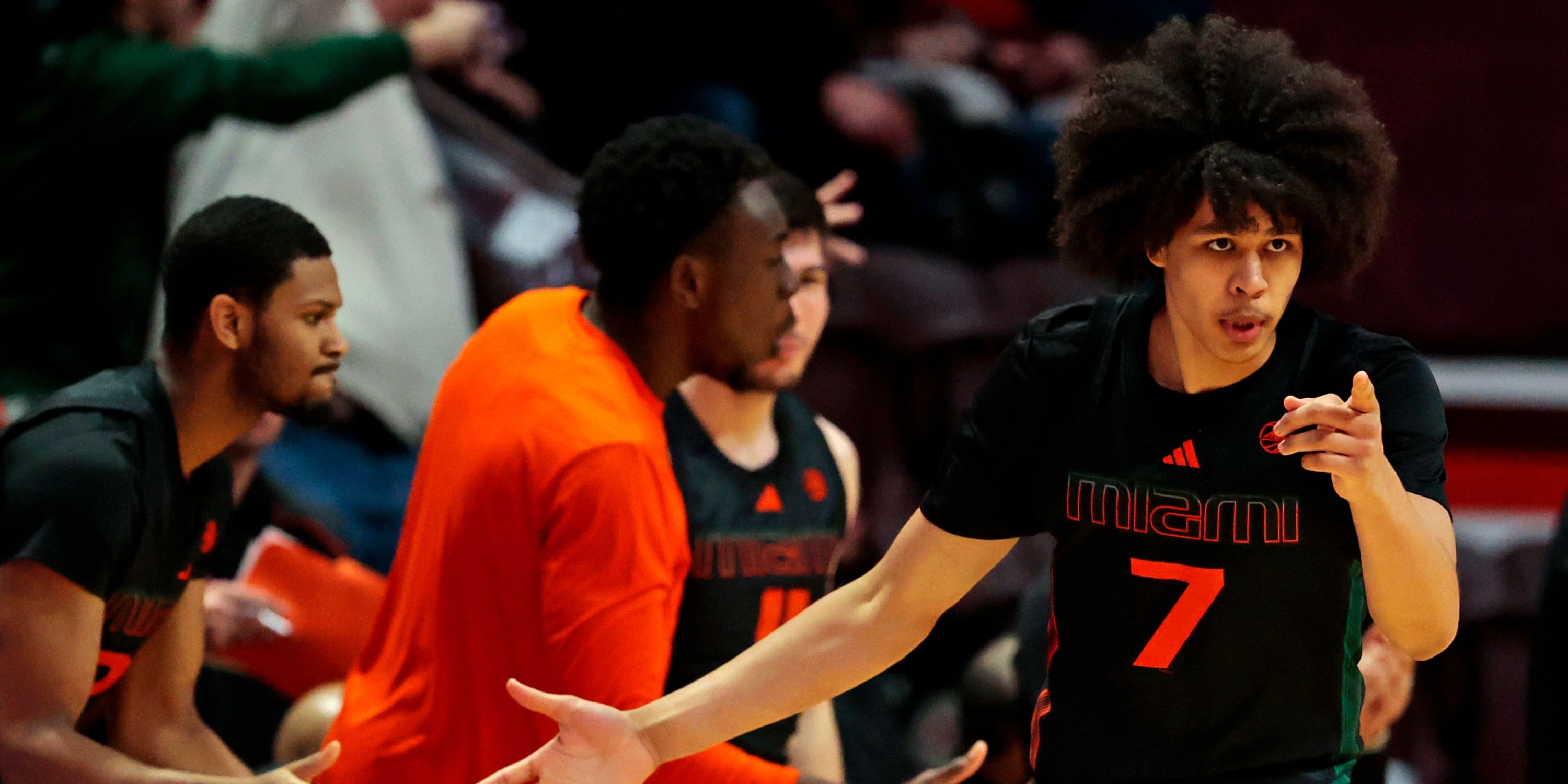 Hurricanes swingman Kyshawn George celebrates with teammates