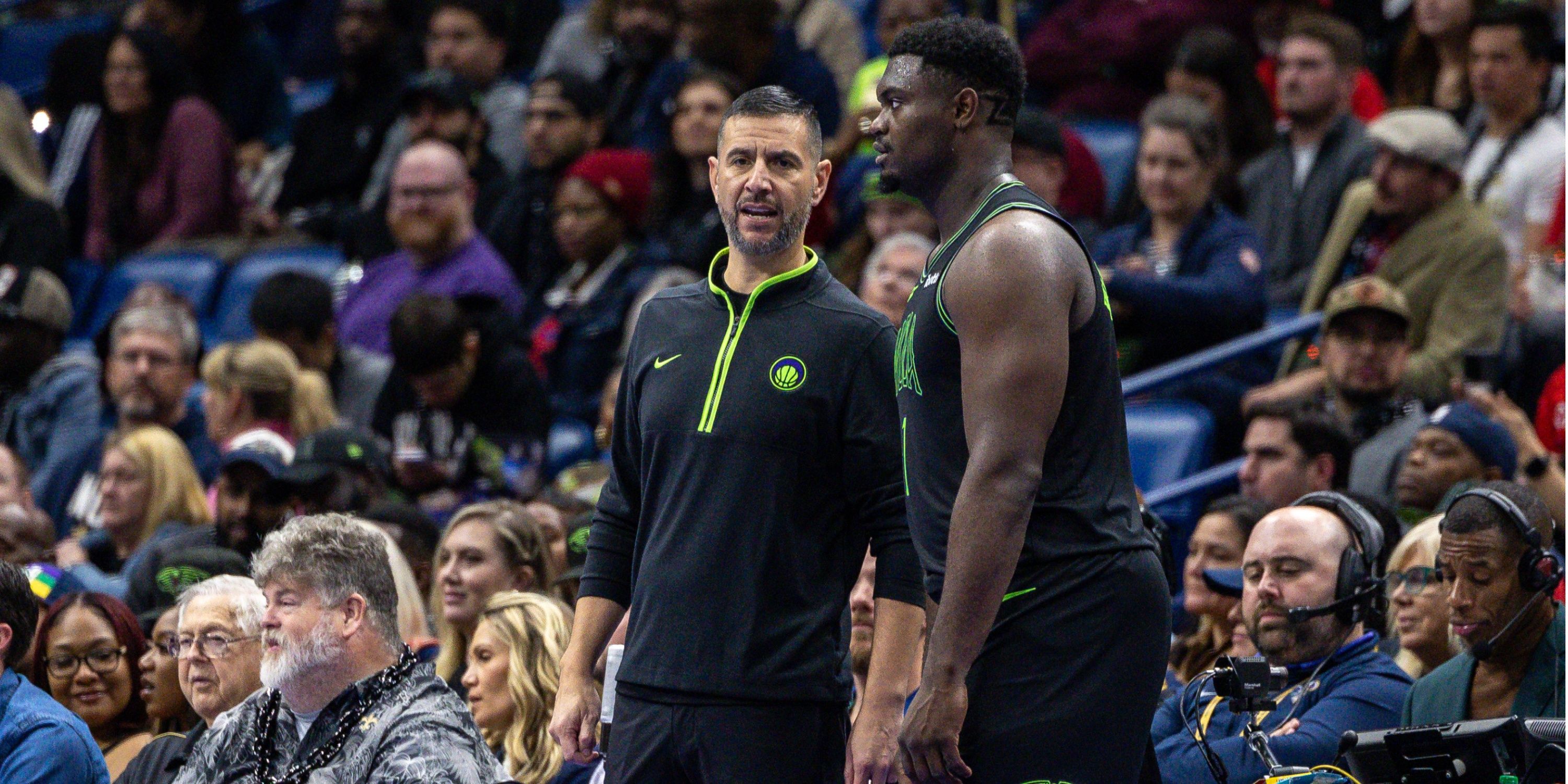 New Orleans Pelicans associate head coach James Borrego talking to Pelicans forward Zion Williamson during a game against the Dallas Mavericks.