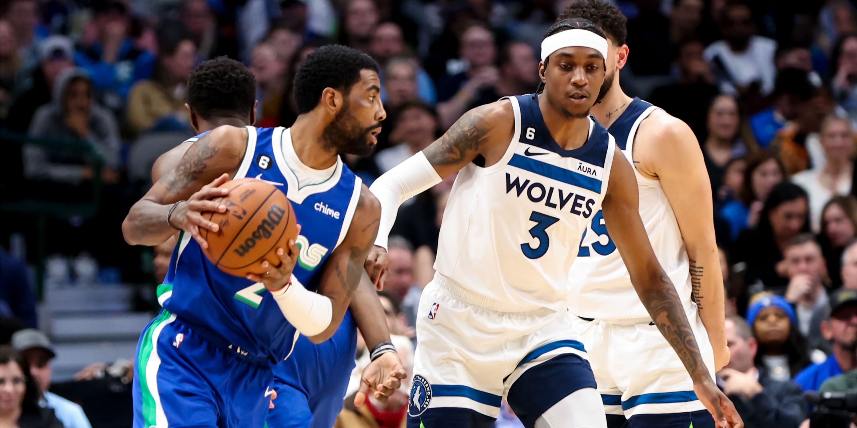 Jaden McDaniels guards Kyrie Irving