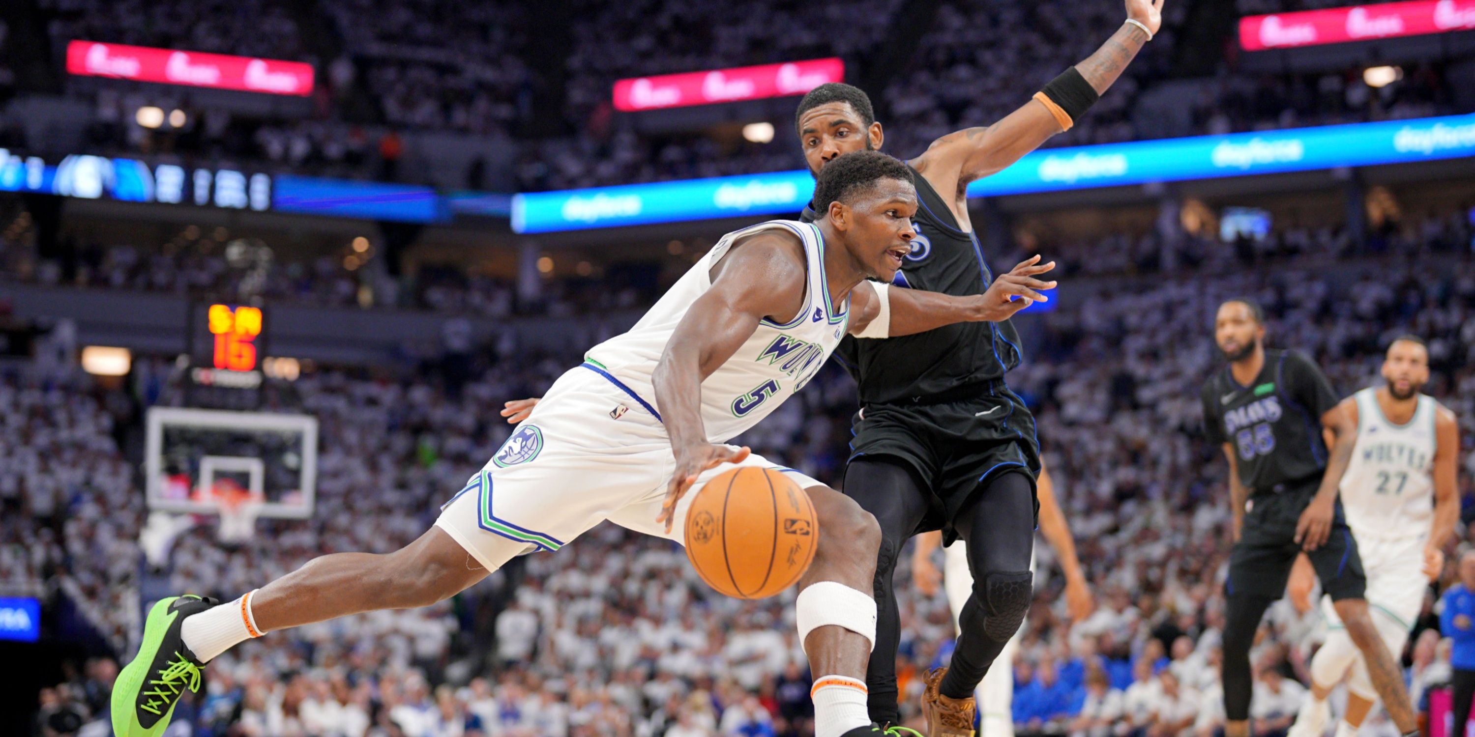 Anthony Edwards drives against Kyrie Irving