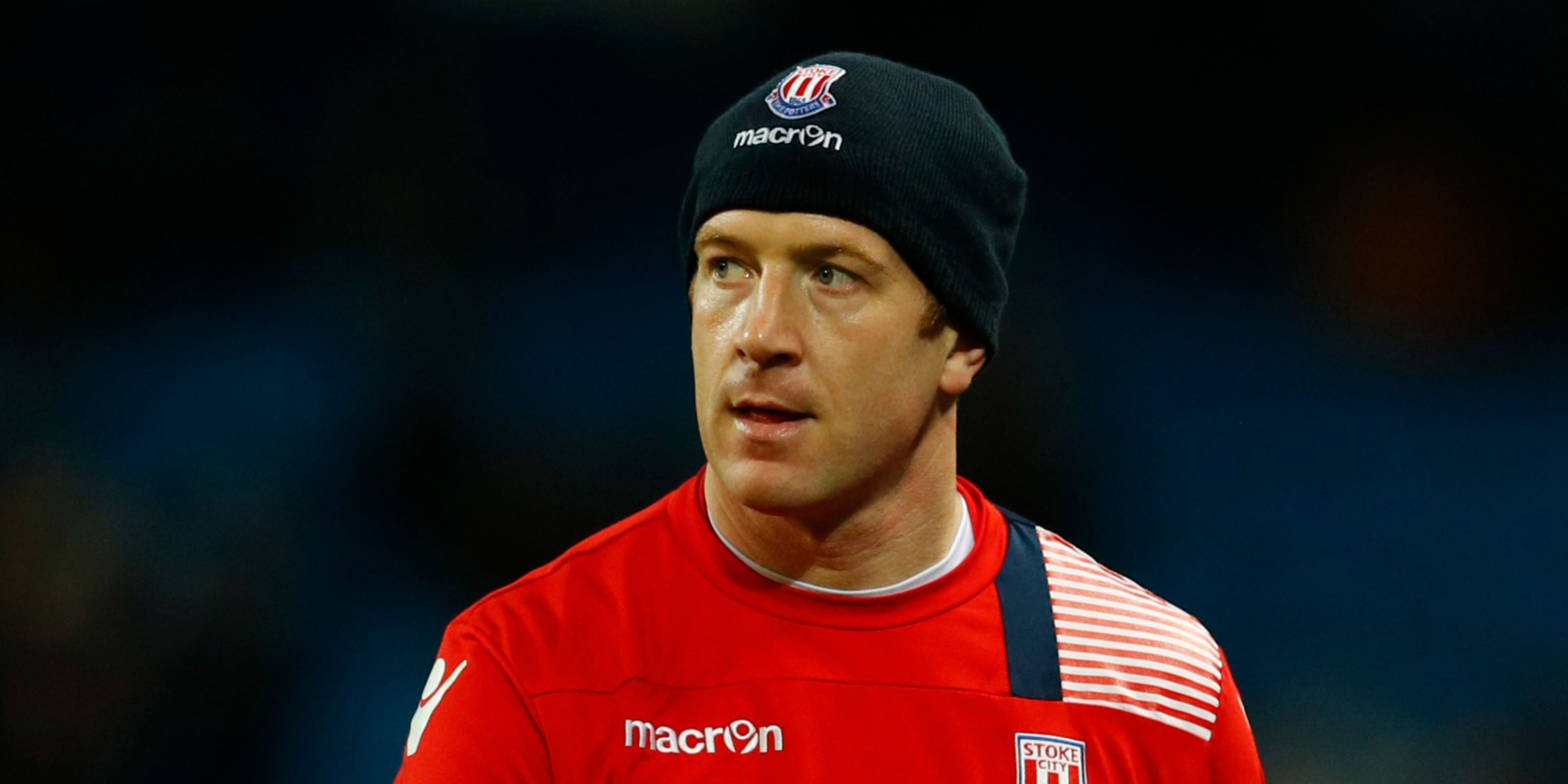 Stoke City's Charlie Adam watches on.