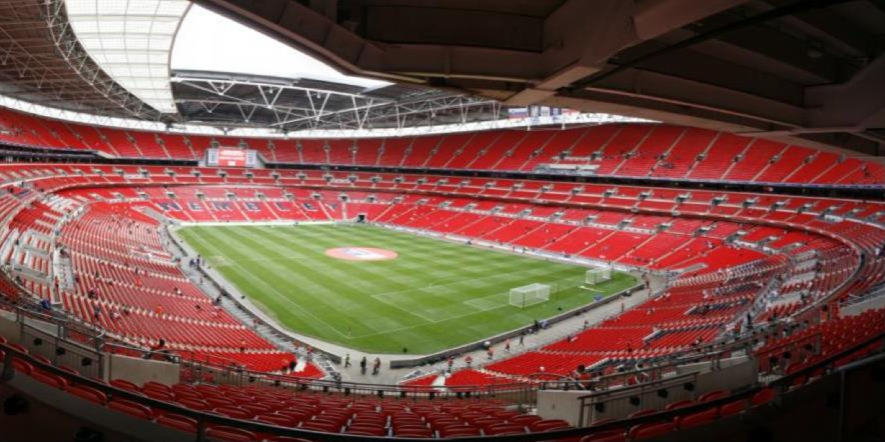 A wide shot of Wembley Stadium in London, England. 
