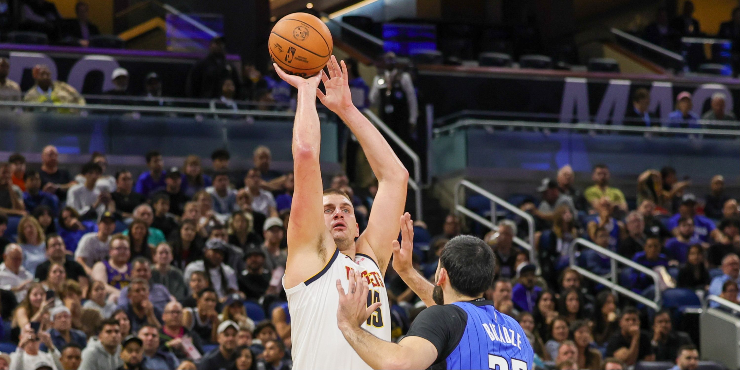 Nikola Jokic shooting over Goga Bitadze