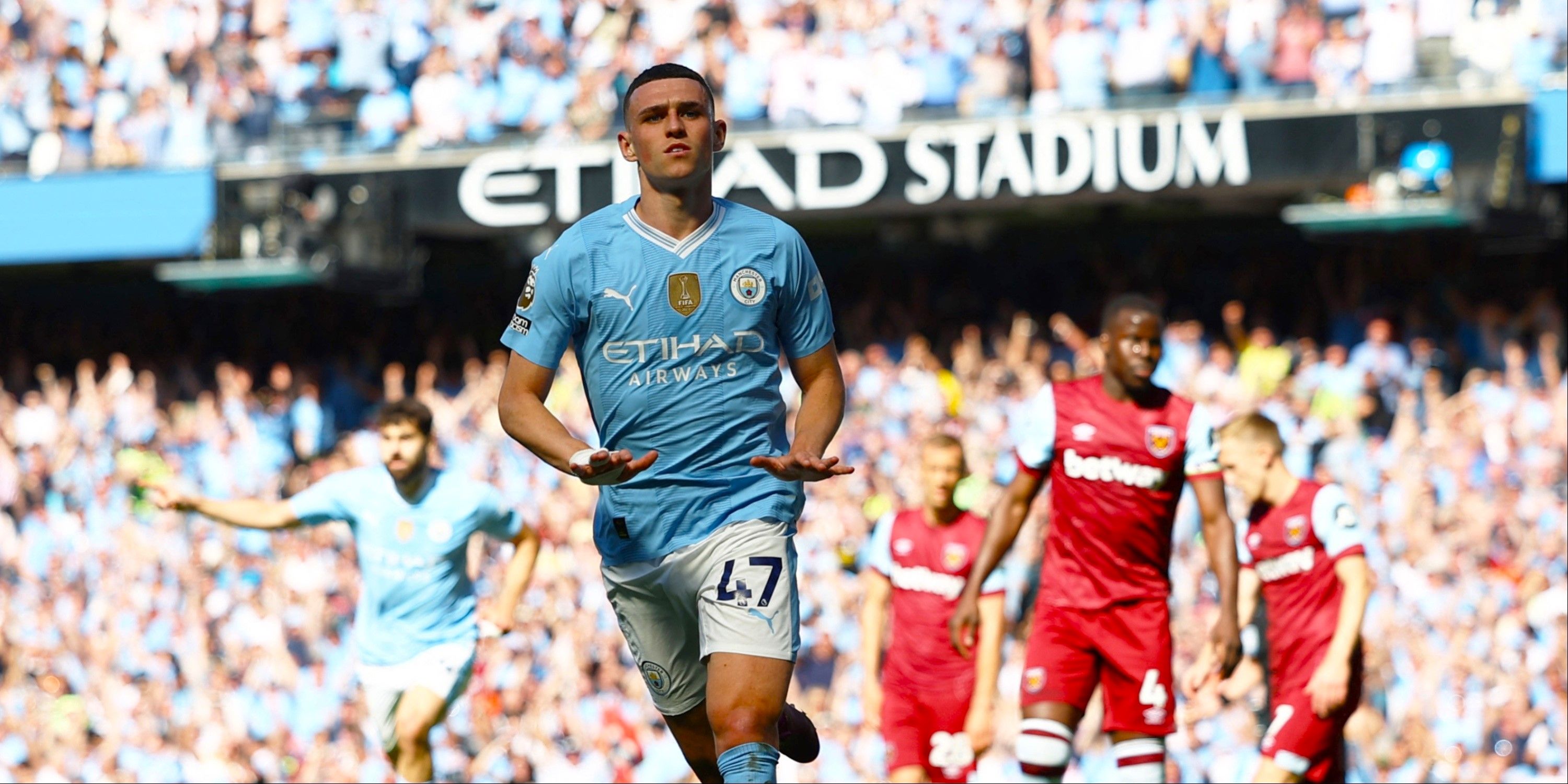 Phil Foden celebrates scoring for Manchester City. 