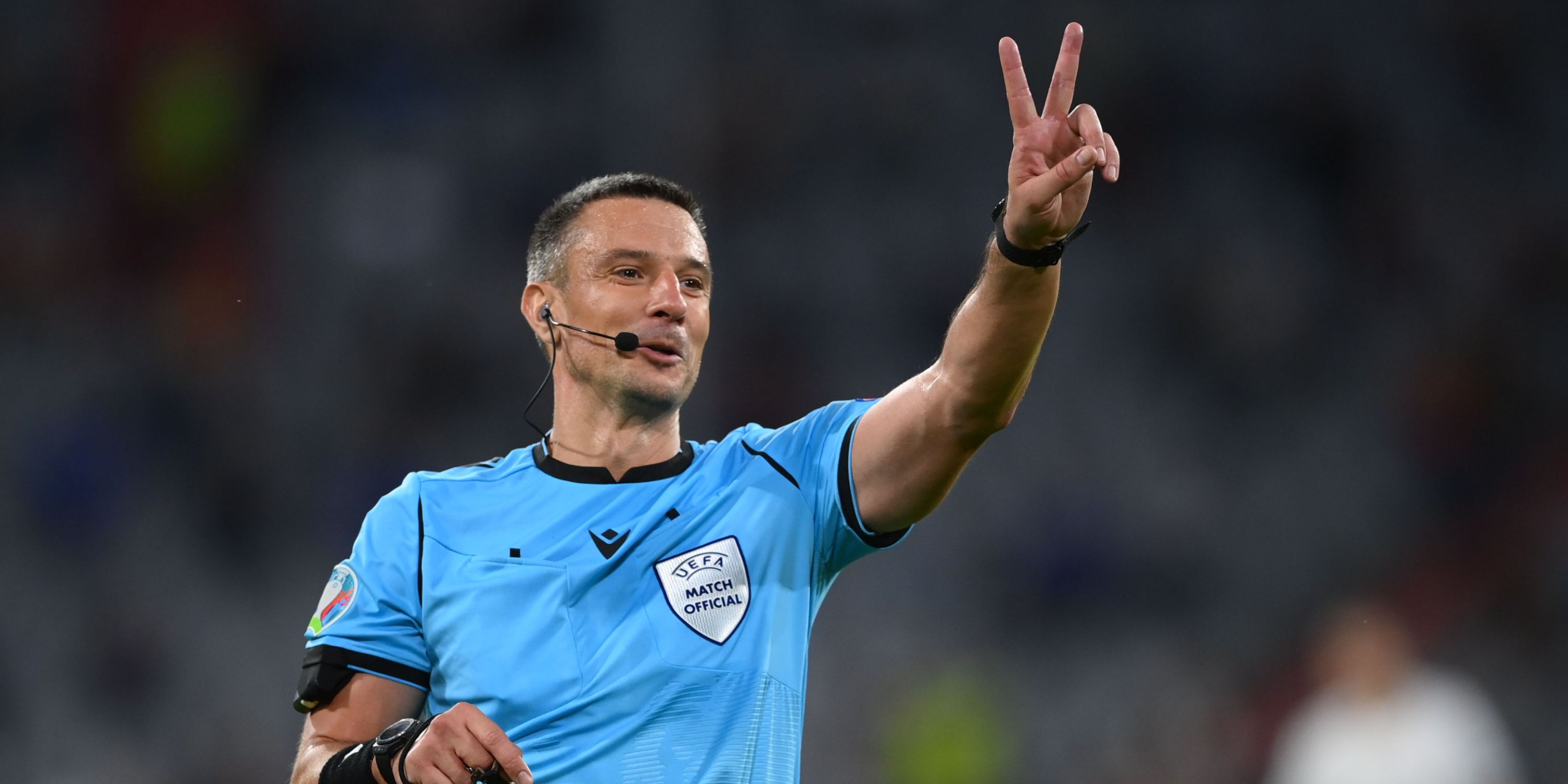 Slavko Vincic throwing up two fingers