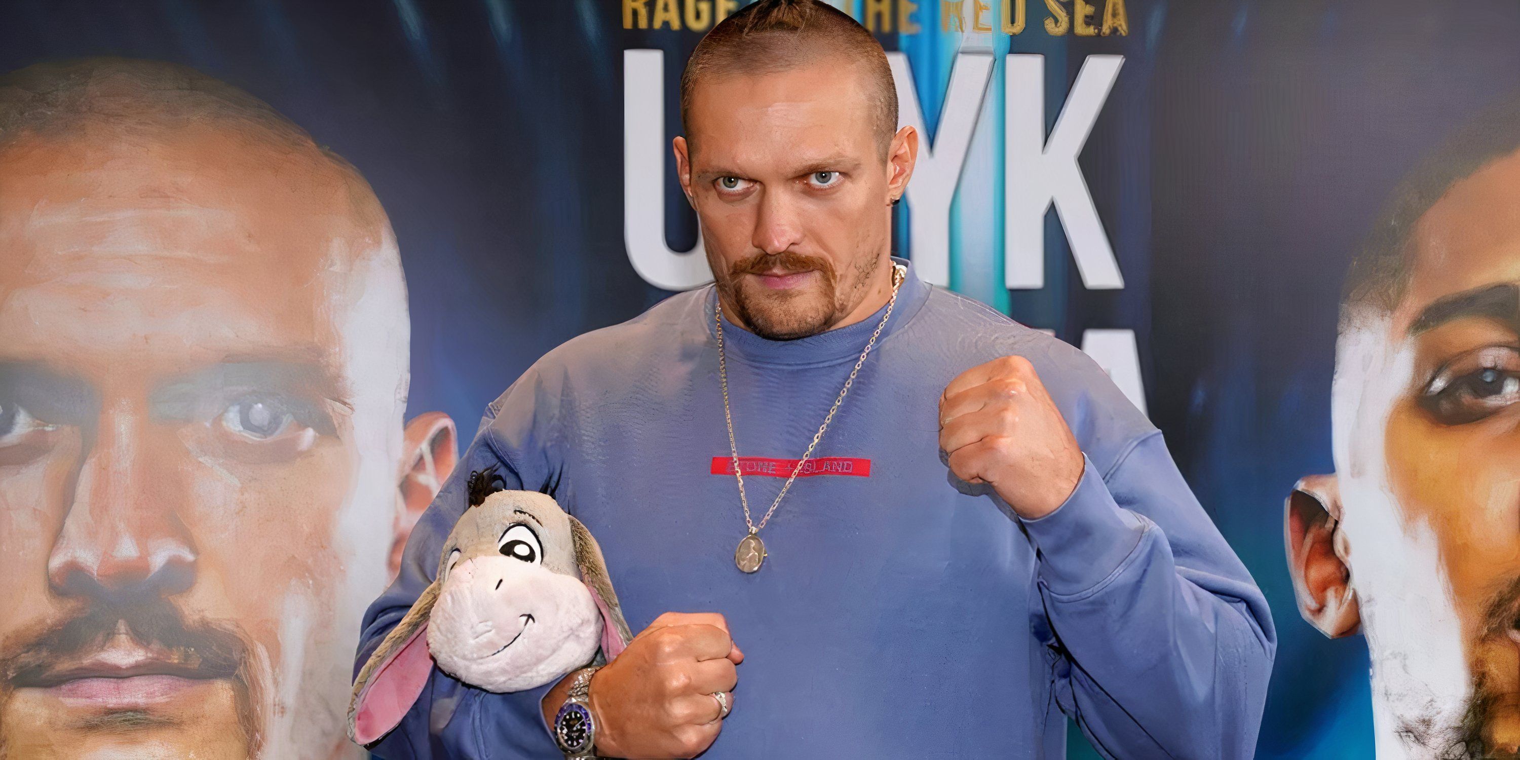 Usyk holds Eeyore from Winnie The Pooh