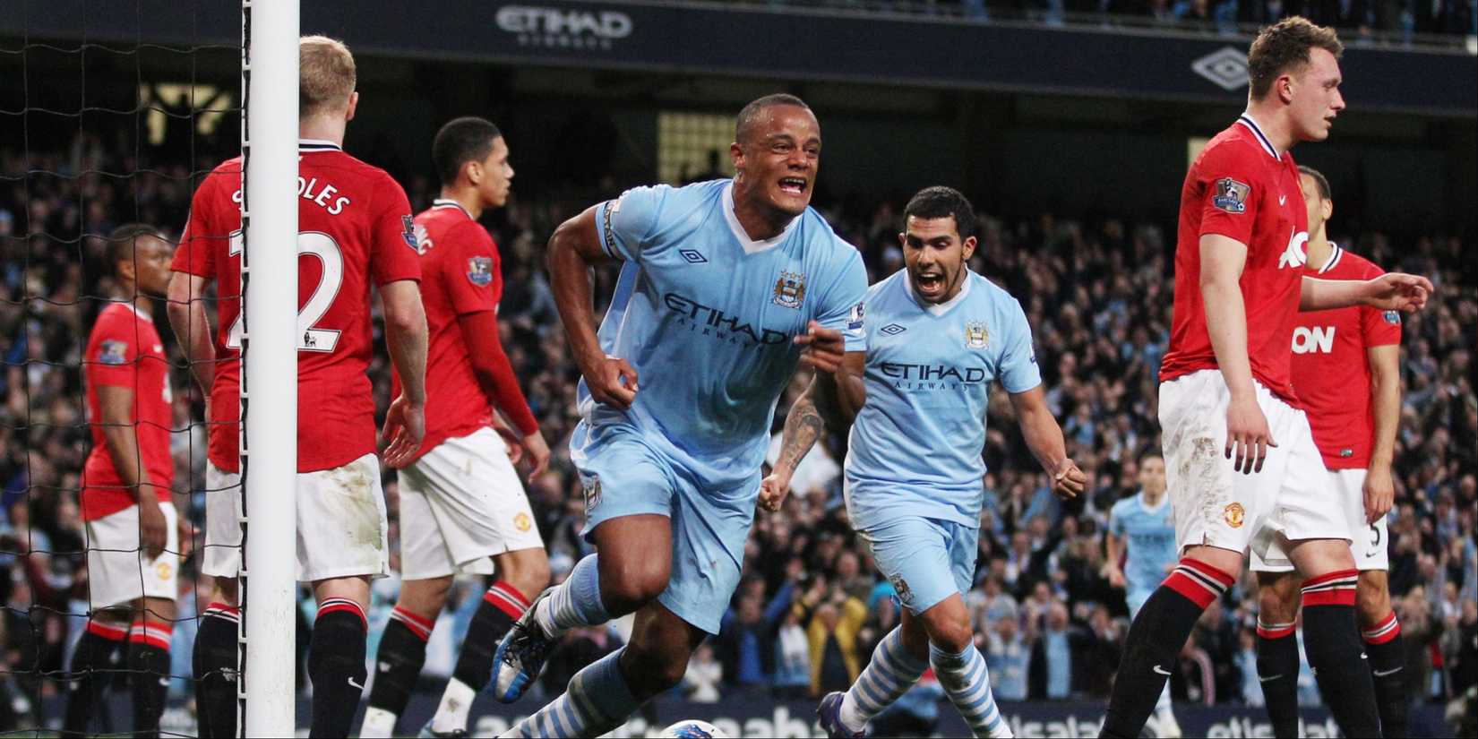 Manchester City's Vincent Kompany celebrates scoring against Manchester United.