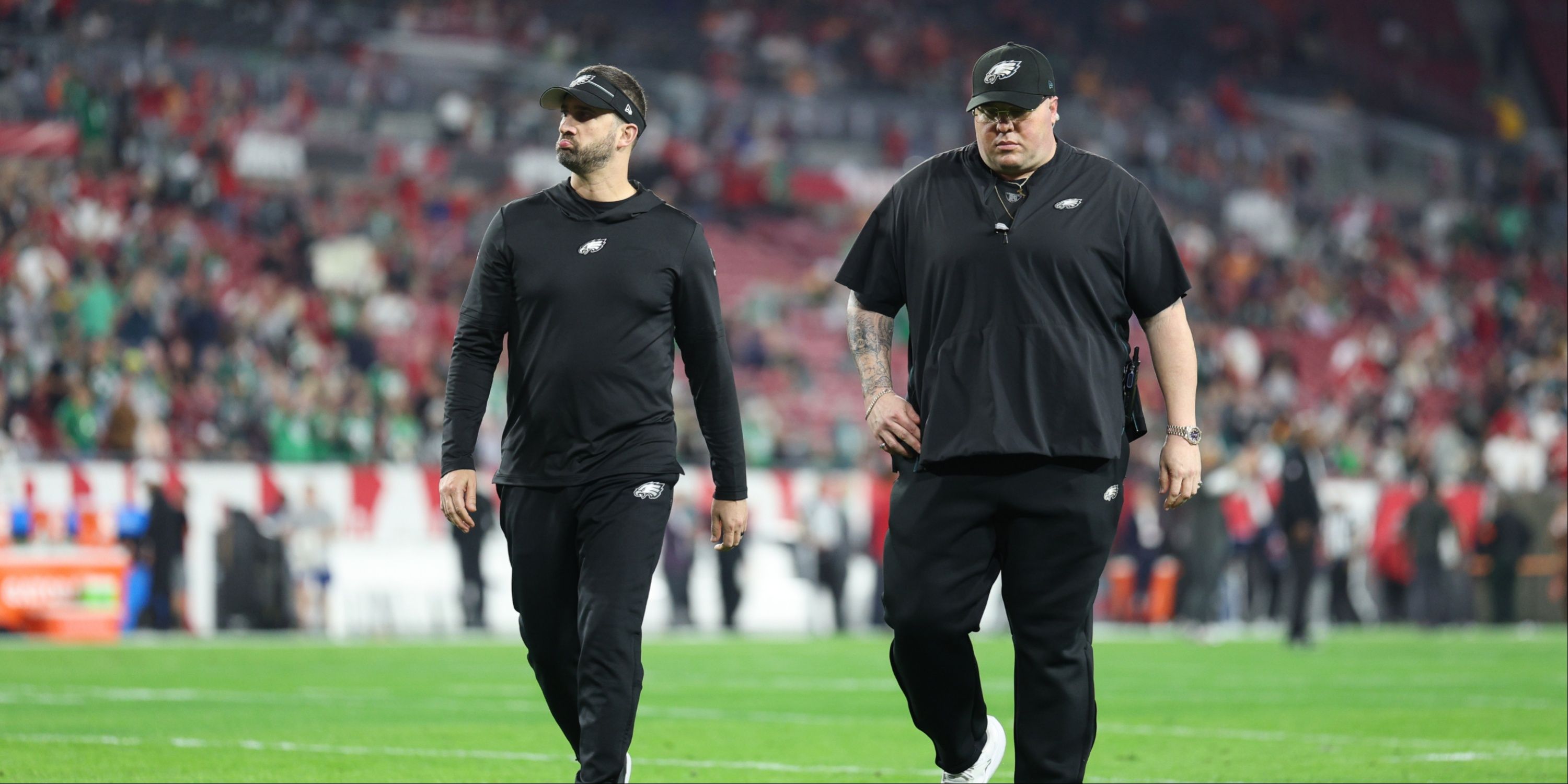 Philadelphia Eagles head coach Nick Sirianni and chief security officer Dom DiSandro walk off the field before a 2024 NFC wild card game against the Tampa Bay Buccaneers