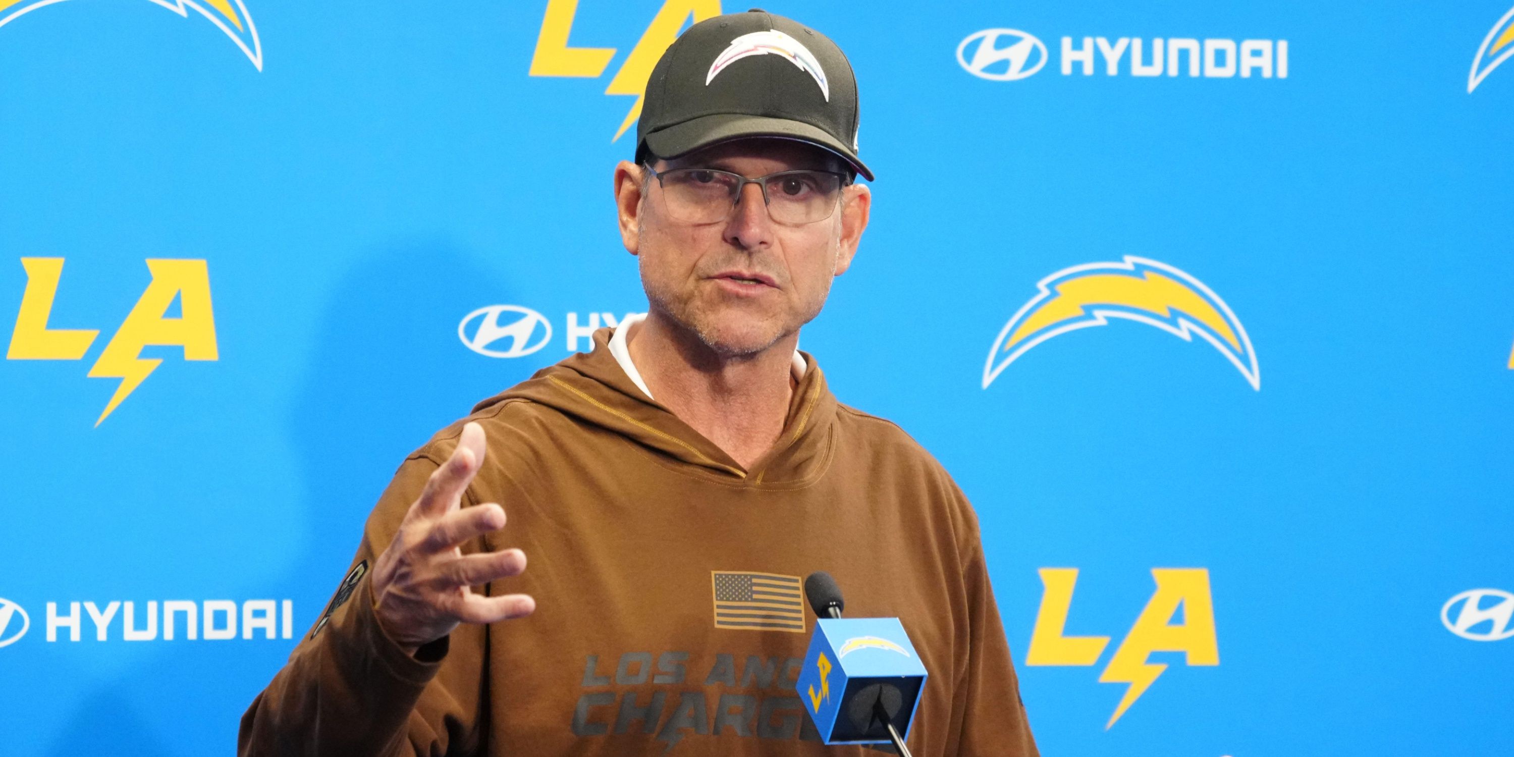 Jim Harbaugh at a Chargers press conference.