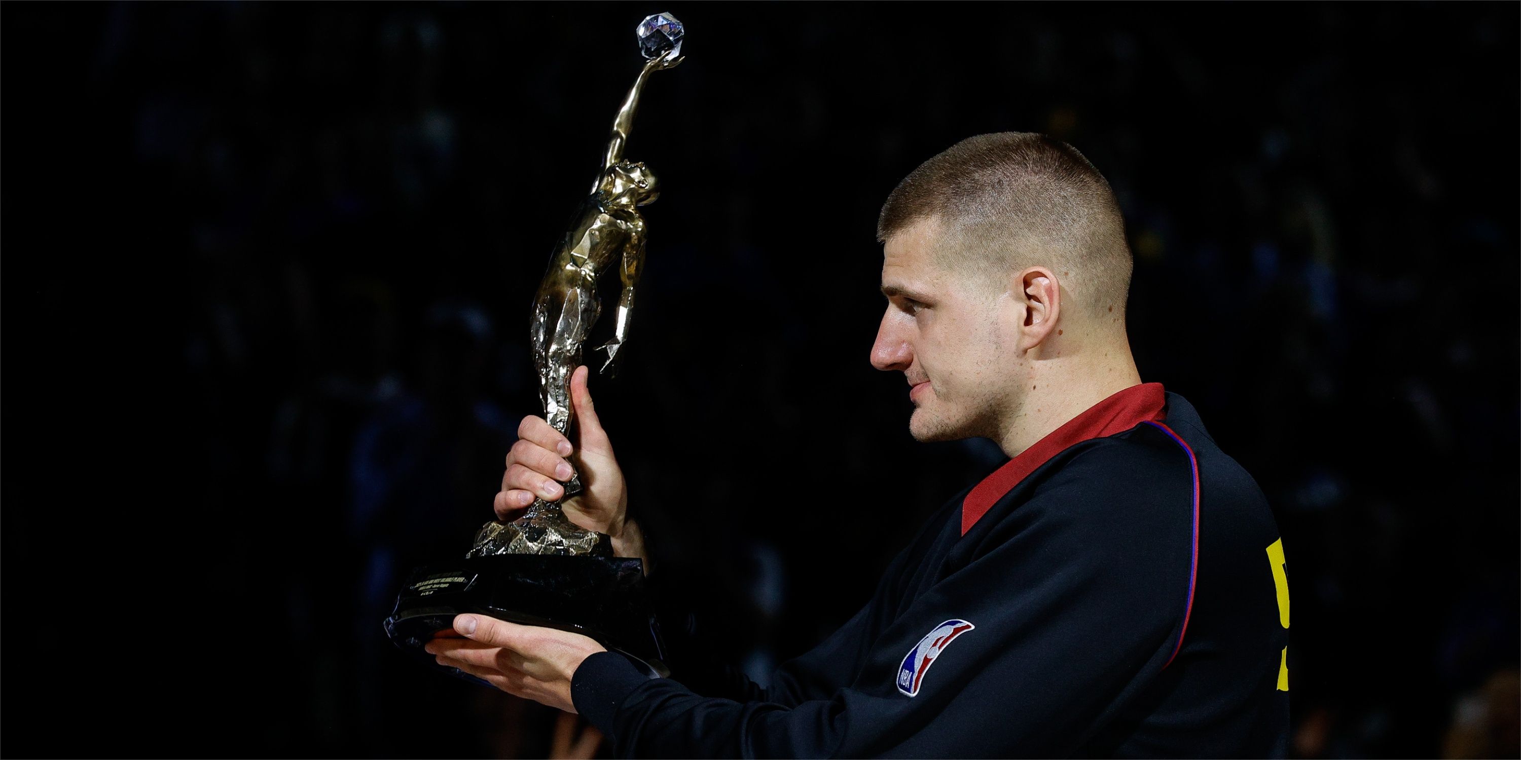 Nikola Jokic holds up third MVP award