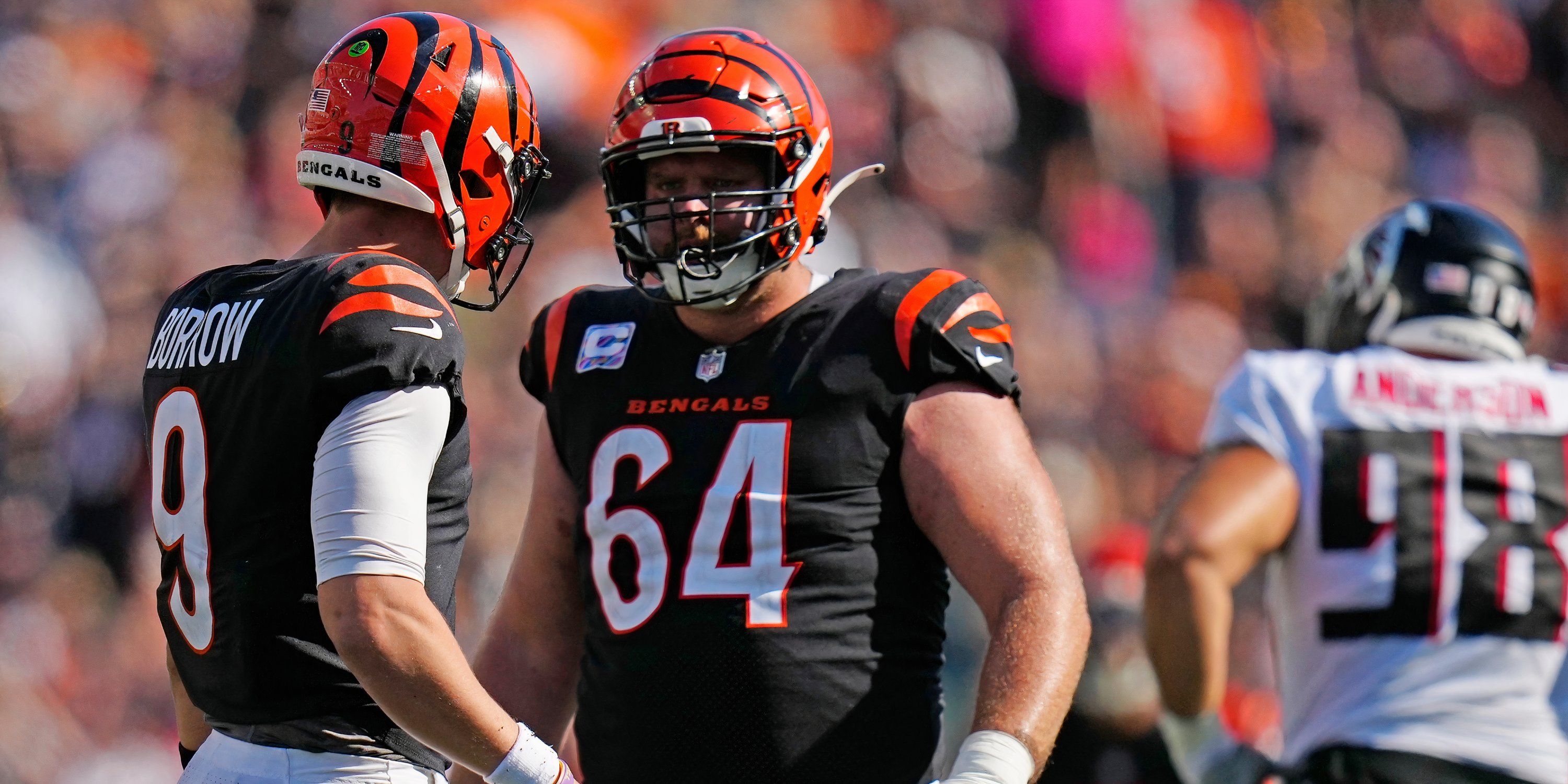 Ted Karras and Joe Burrow talk on the field 