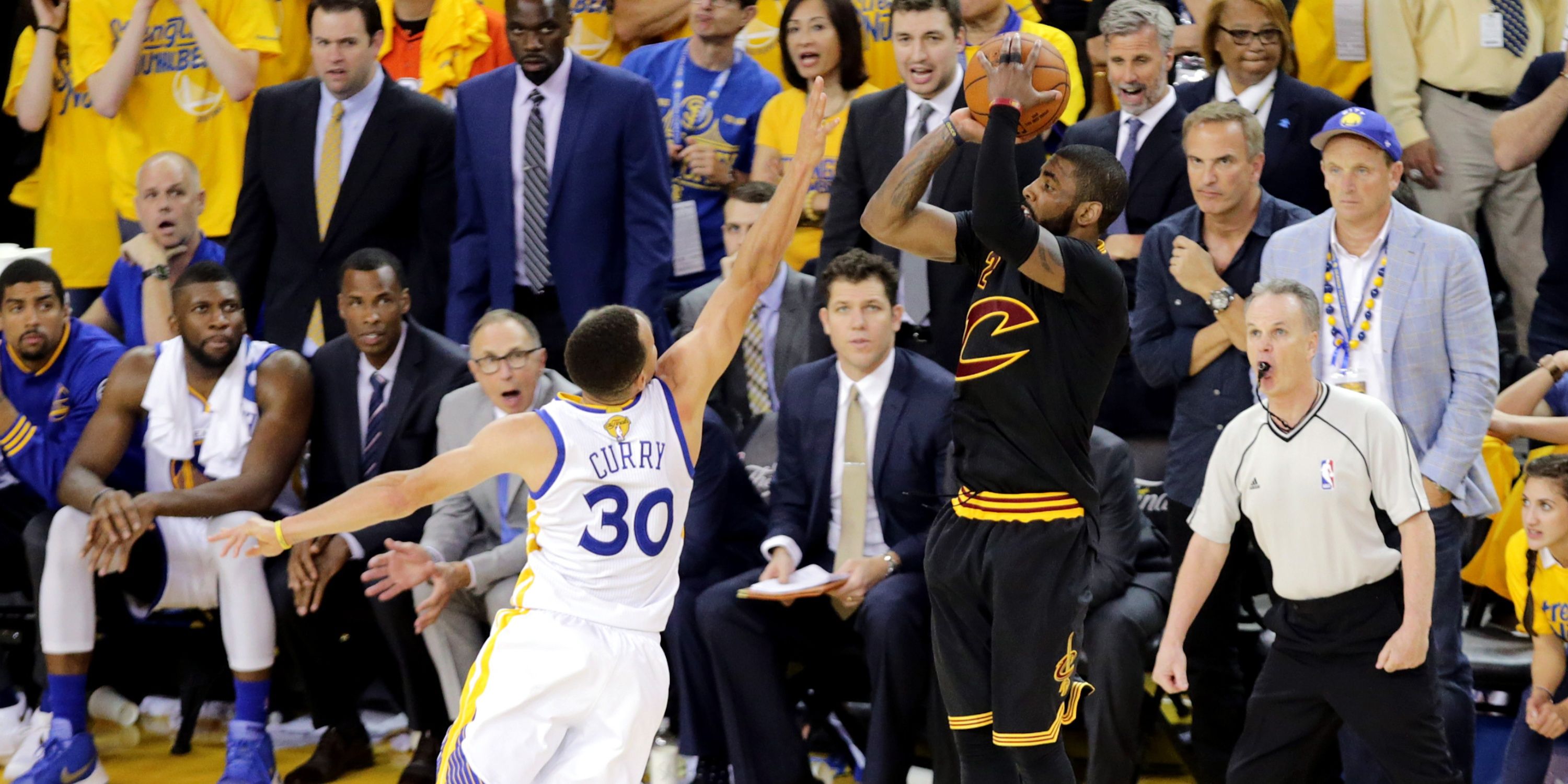 Kyrie Irving shoots over Stephen Curry