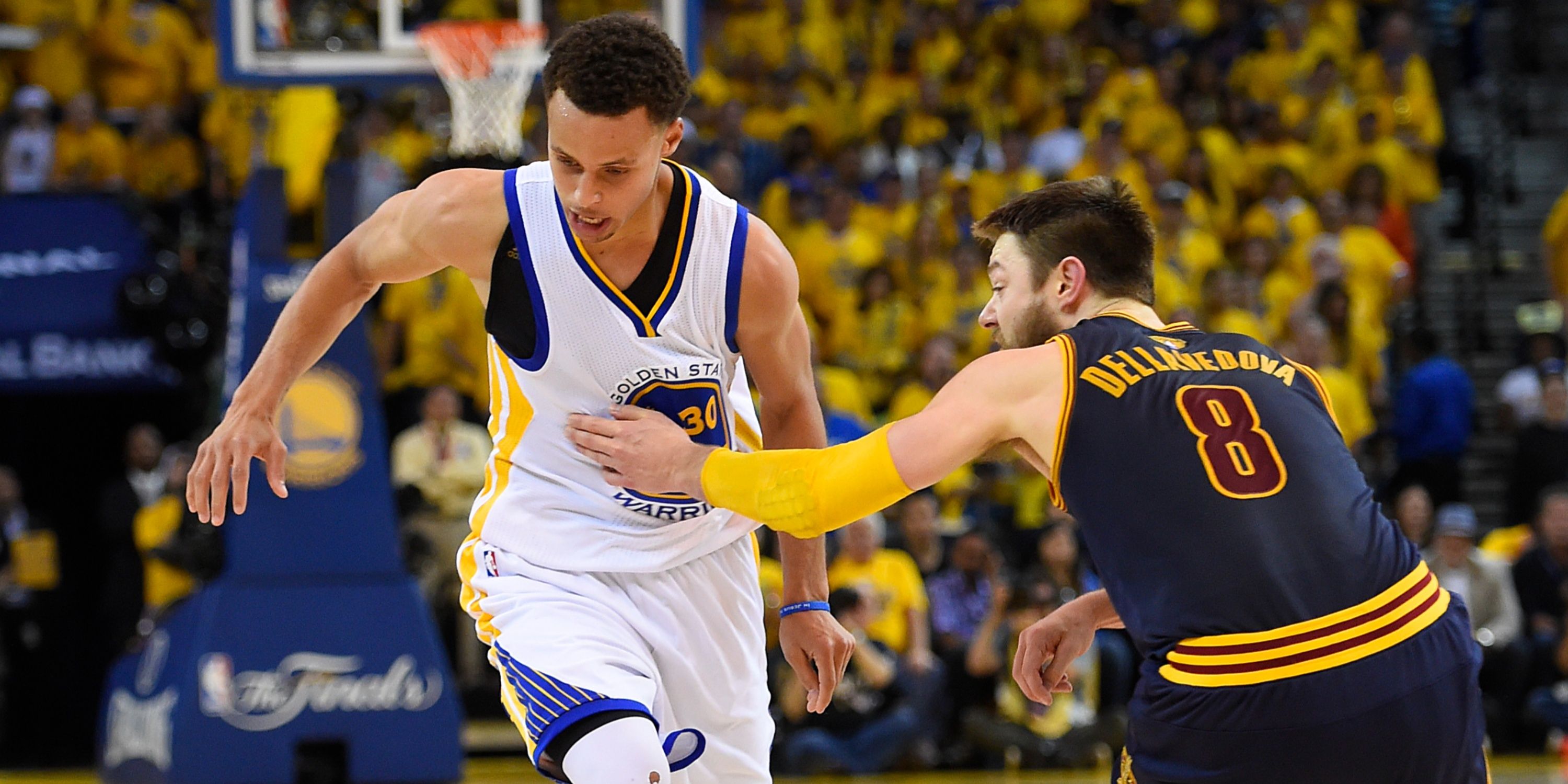 Golden State Warriors guard Stephen Curry and Cleveland Cavaliers guard Matthew Dellavedova