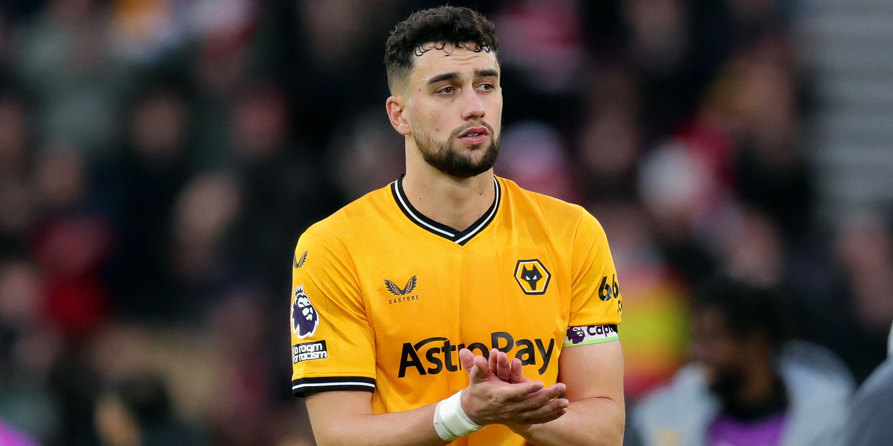 Wolverhampton Wanderers defender Max Kilman applauding supporters